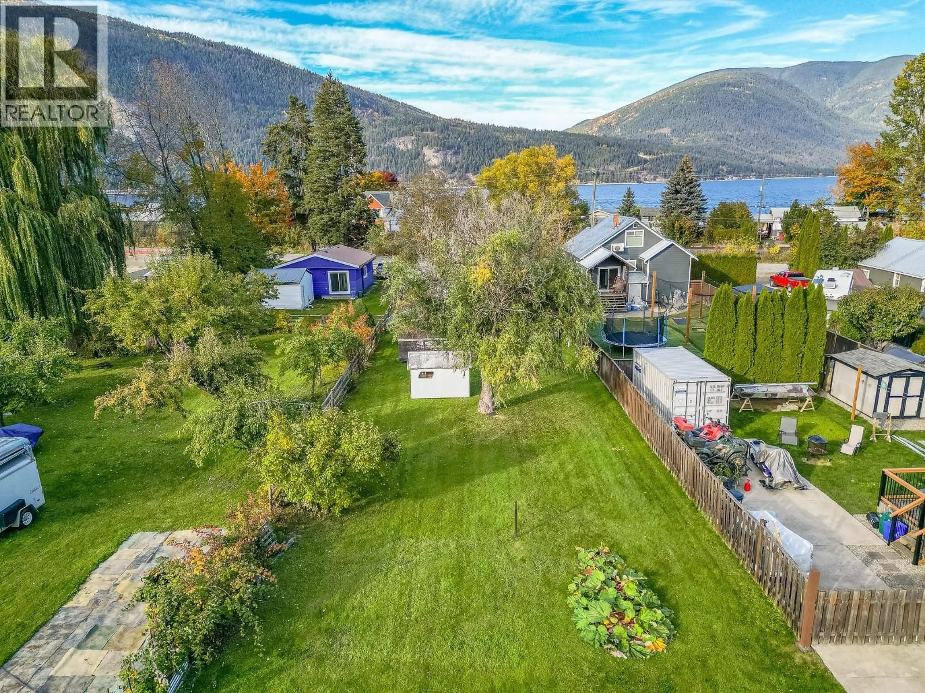 A pic from outside/outdoor area/front of a property/back of a property/a pic from drone, water/lake/river/ocean view for 4760 CANOE BEACH DRIVE DRIVE NORTHEAST, Salmon Arm British Columbia V0E1K0