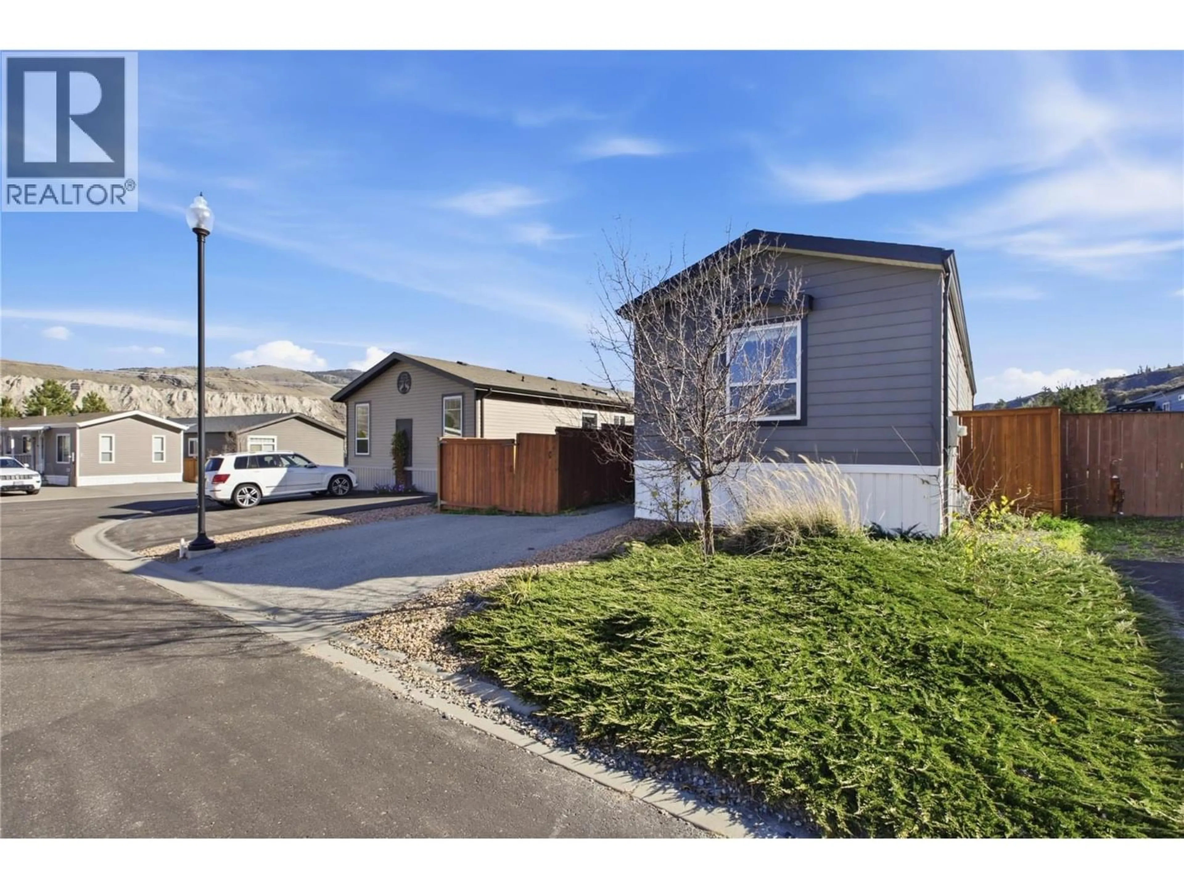 A pic from outside/outdoor area/front of a property/back of a property/a pic from drone, street for 7 - 7805 DALLAS DRIVE, Kamloops British Columbia V2C0E5