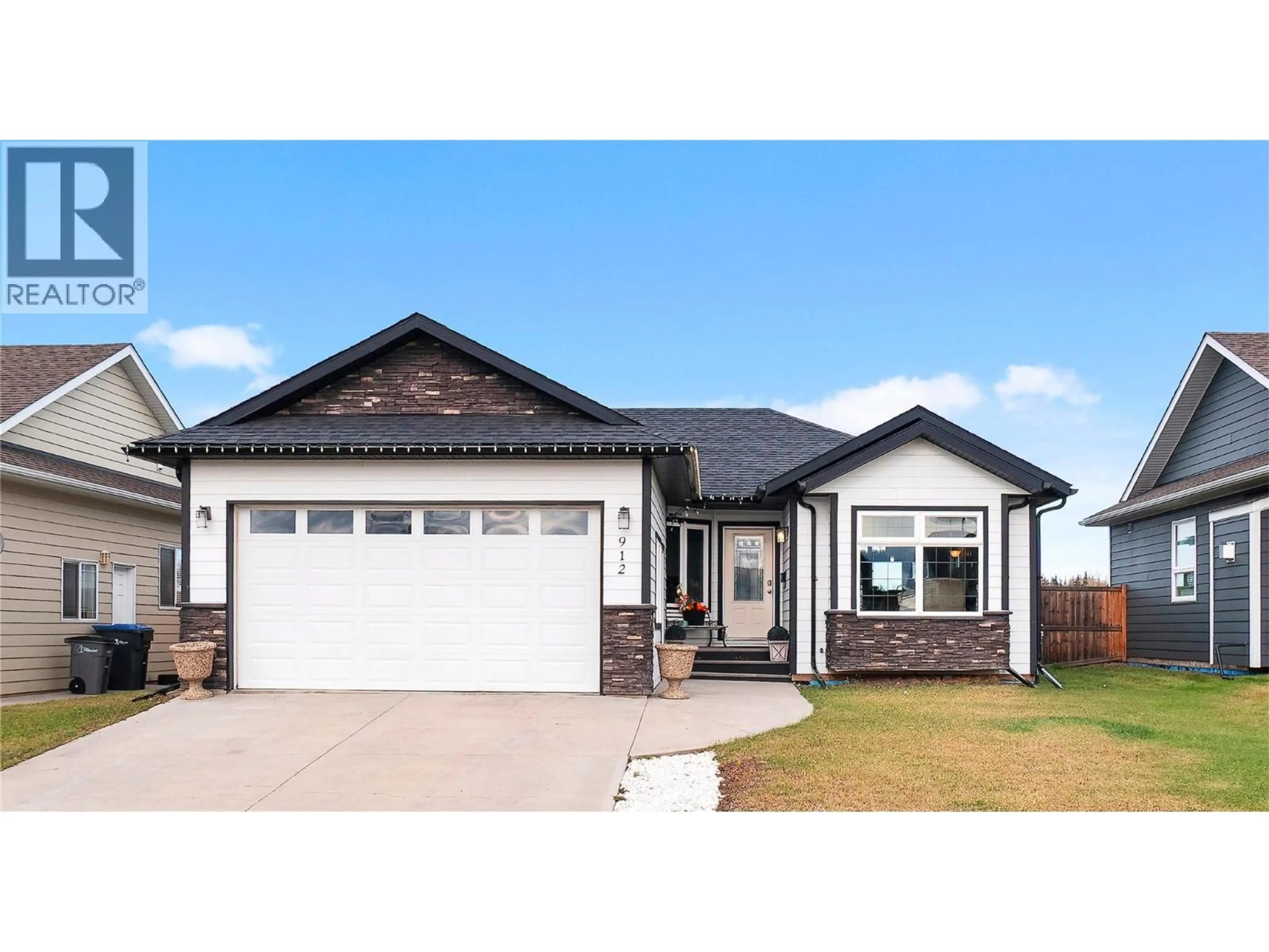 Home with brick exterior material, street for 912 88 AVENUE, Dawson Creek British Columbia V1G0C9