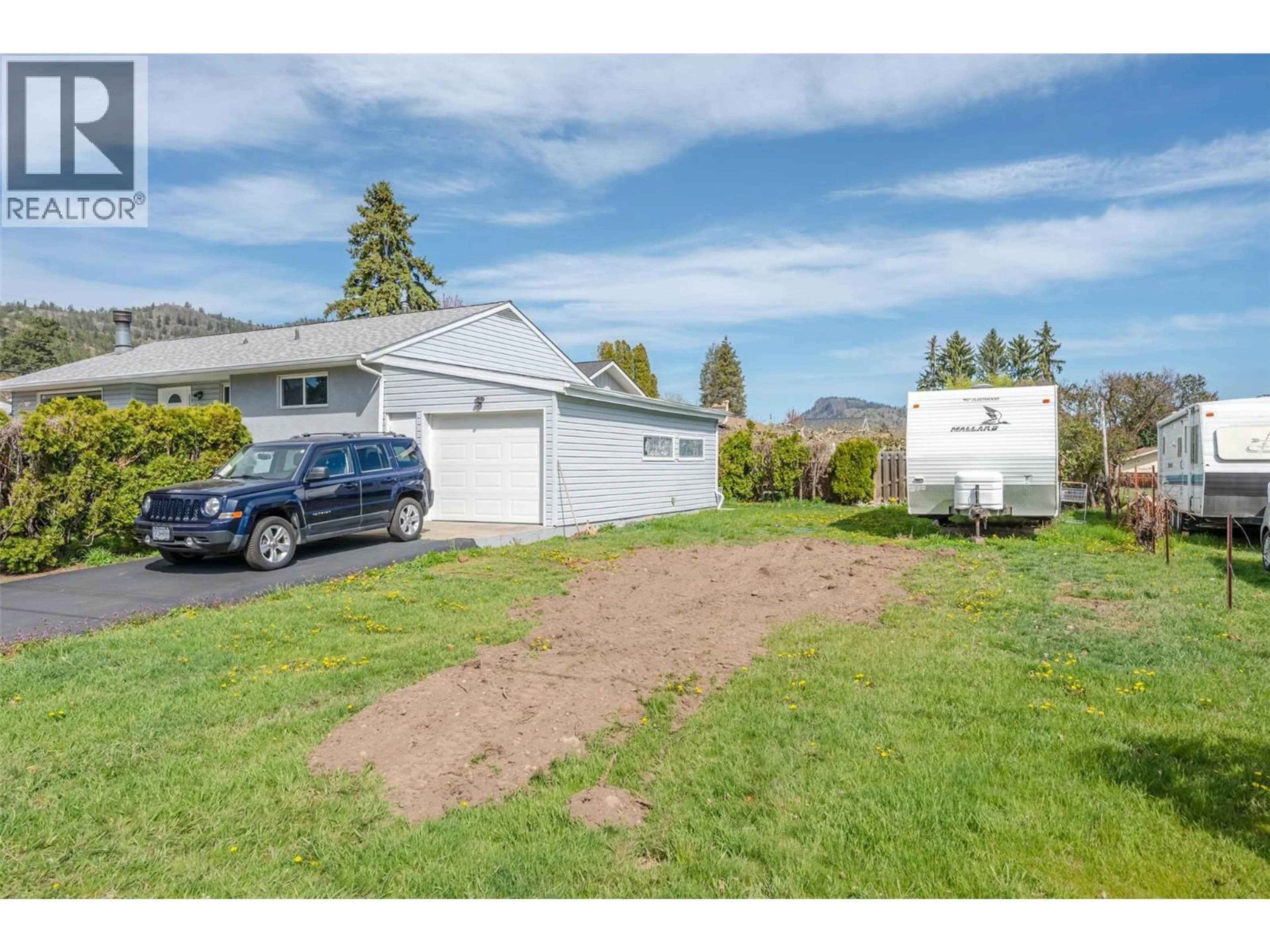 A pic from outside/outdoor area/front of a property/back of a property/a pic from drone, street for 12401 WARD STREET, Summerland British Columbia V0H1Z0