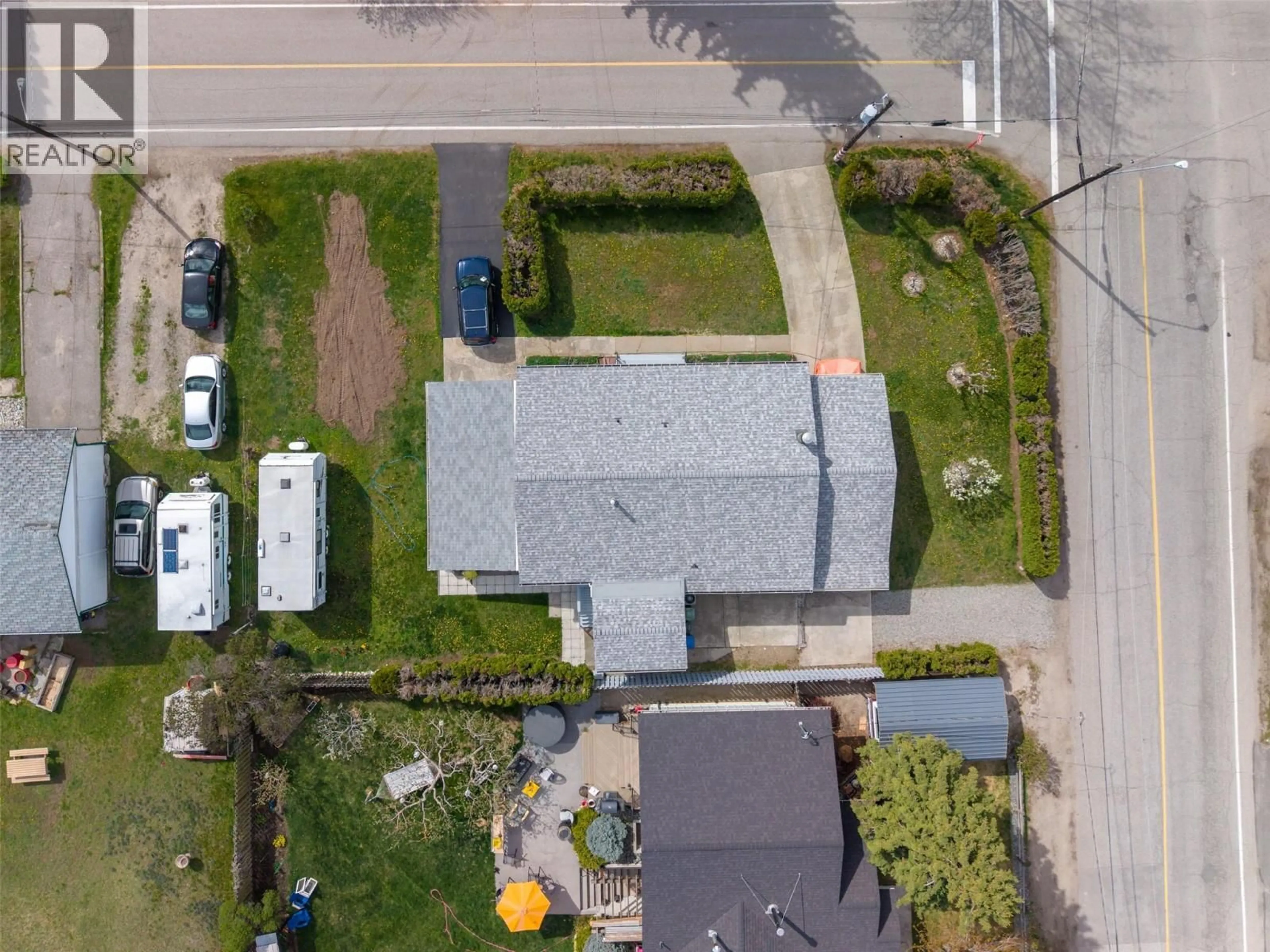 A pic from outside/outdoor area/front of a property/back of a property/a pic from drone, street for 12401 WARD STREET, Summerland British Columbia V0H1Z0