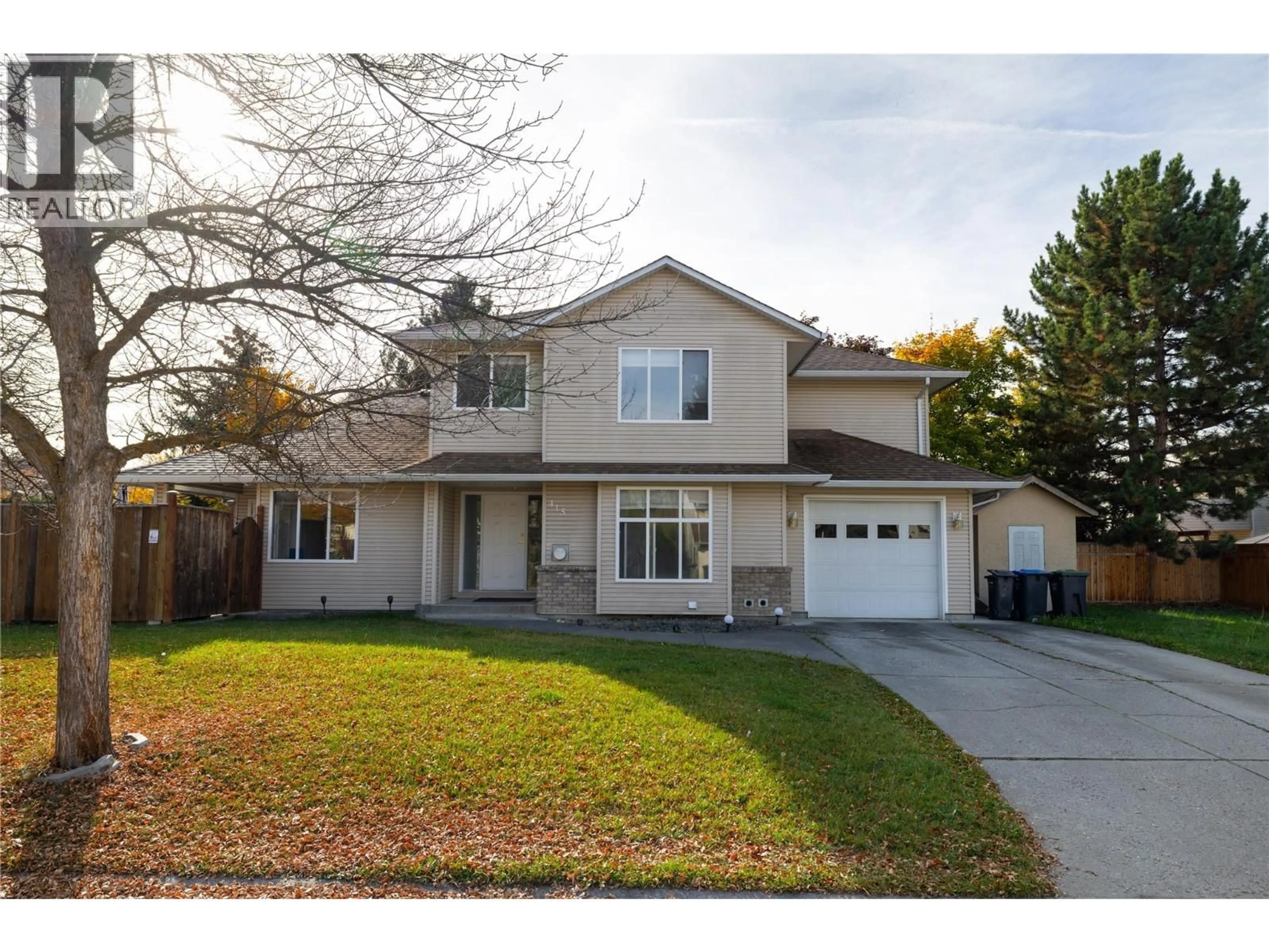 Home with vinyl exterior material, street for 415 KLASSEN ROAD, Kelowna British Columbia V1X7P2