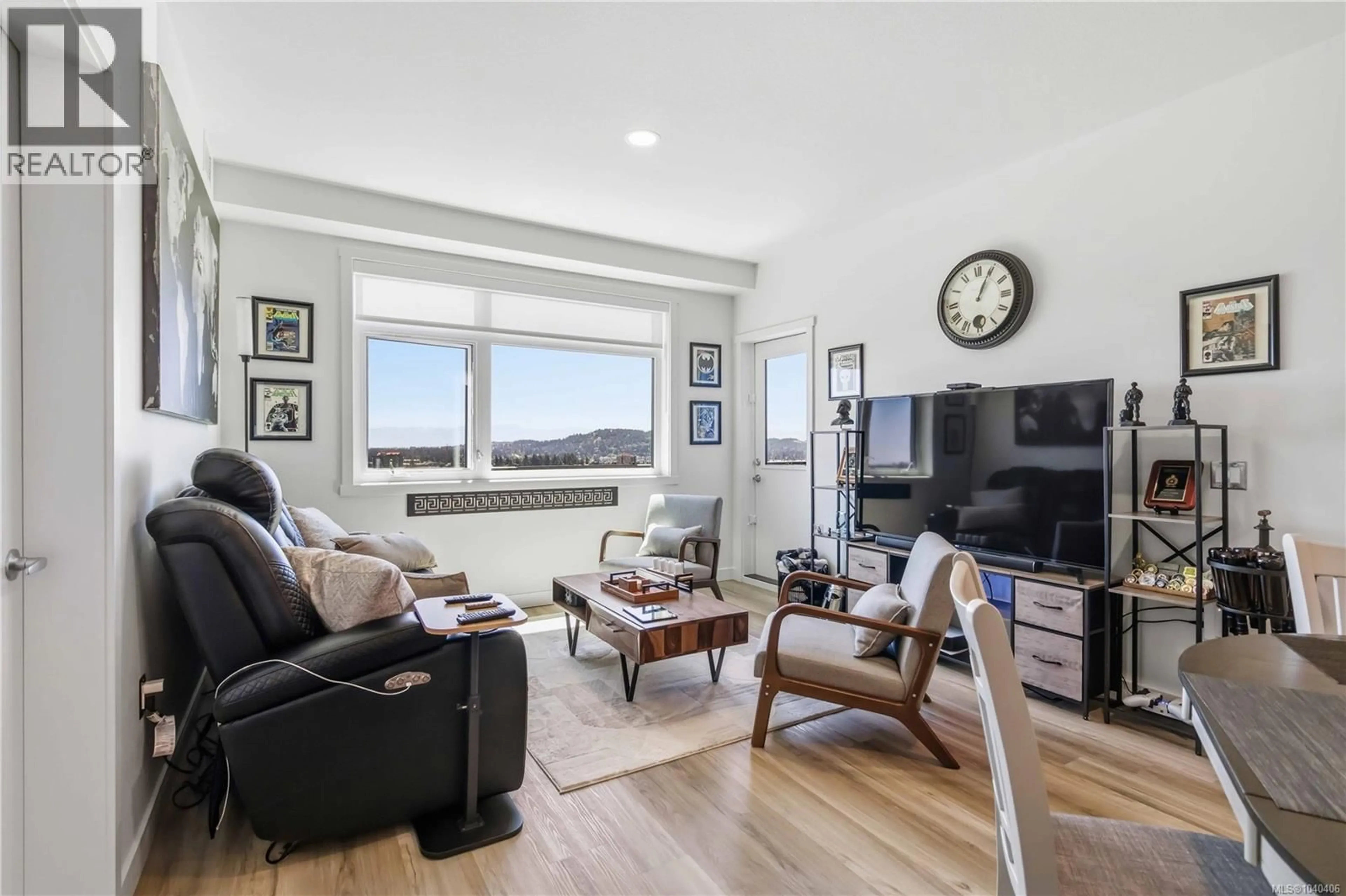 Living room with furniture, wood/laminate floor for 622 - 2390 CITY GATE BOULEVARD, Langford British Columbia V9B7A6