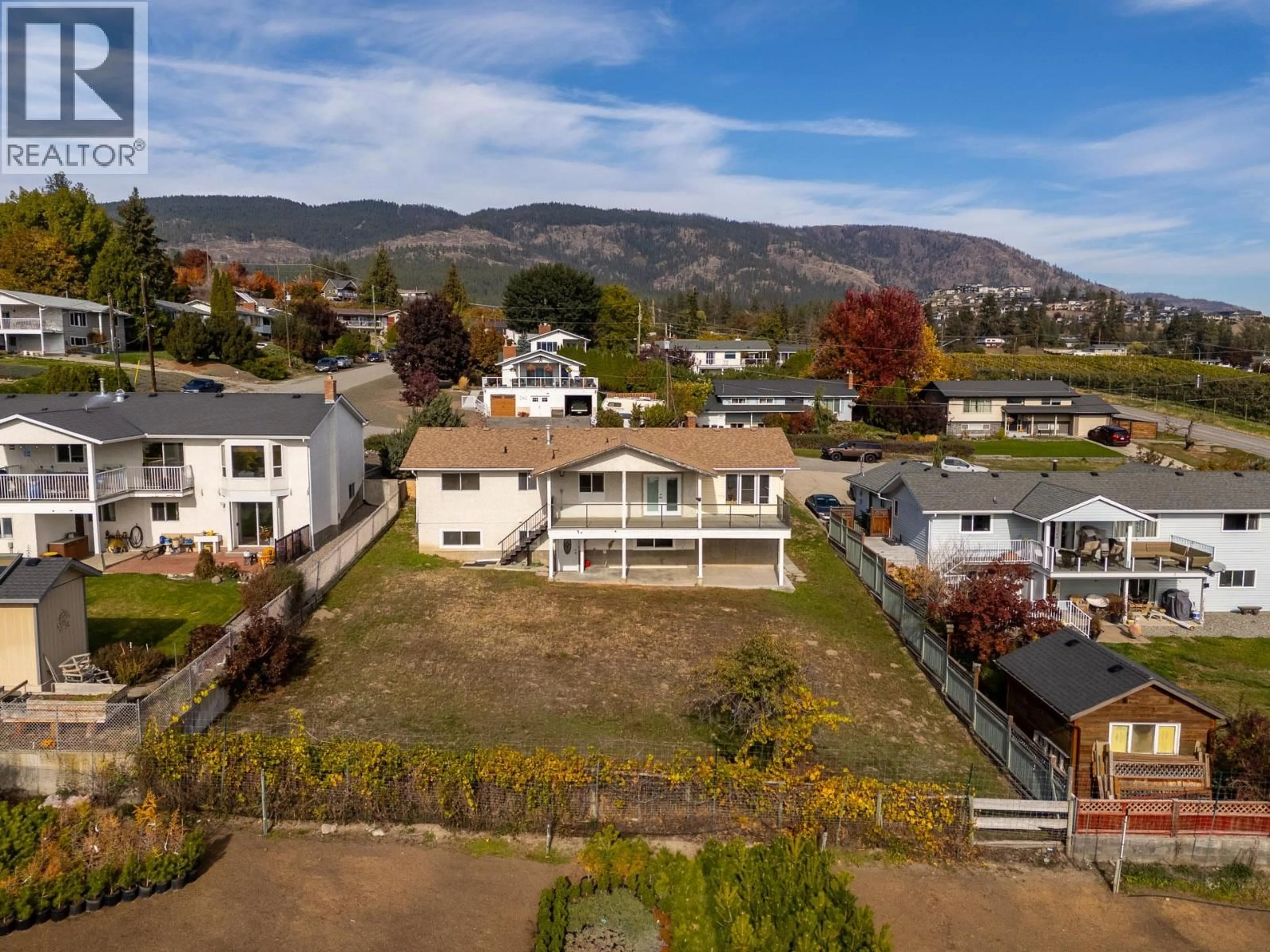 A pic from outside/outdoor area/front of a property/back of a property/a pic from drone, mountain view for 2582 NEUFELD CRESCENT, West Kelowna British Columbia V4T1P2