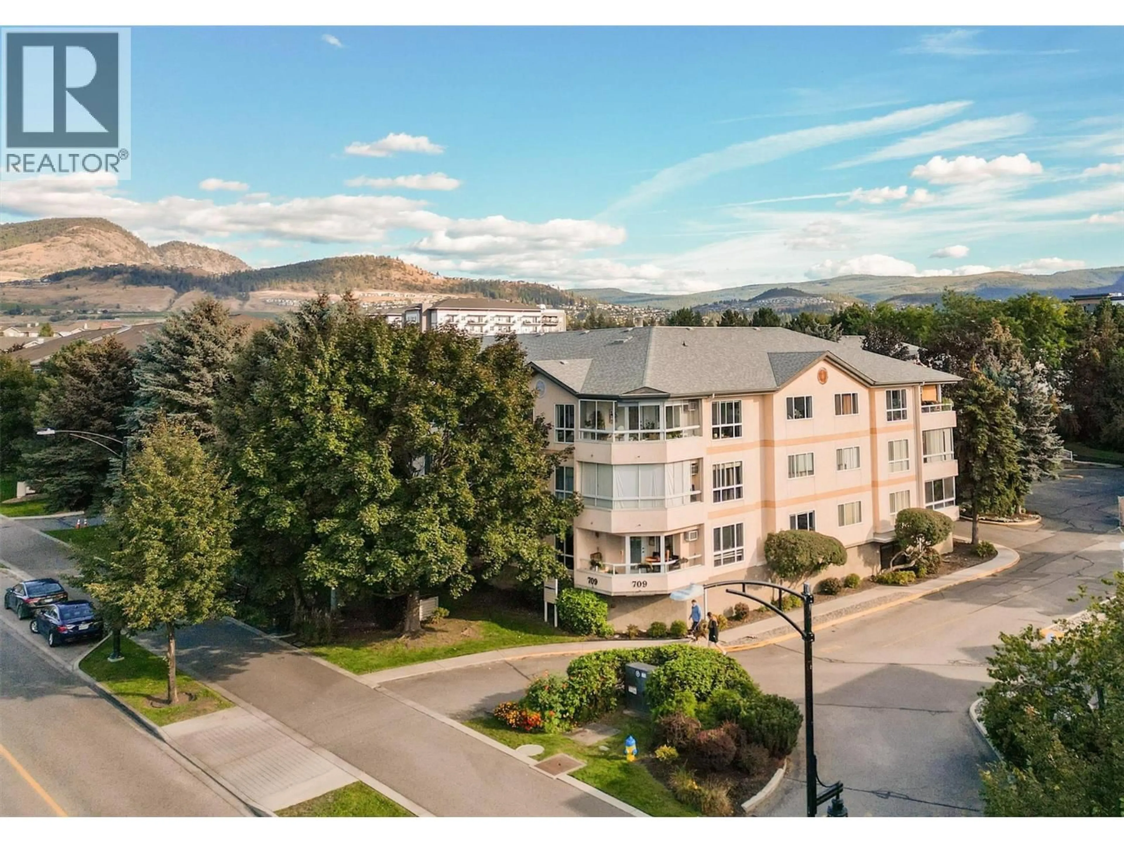 A pic from outside/outdoor area/front of a property/back of a property/a pic from drone, mountain view for 311 - 709 HOUGHTON ROAD, Kelowna British Columbia V1X7J7