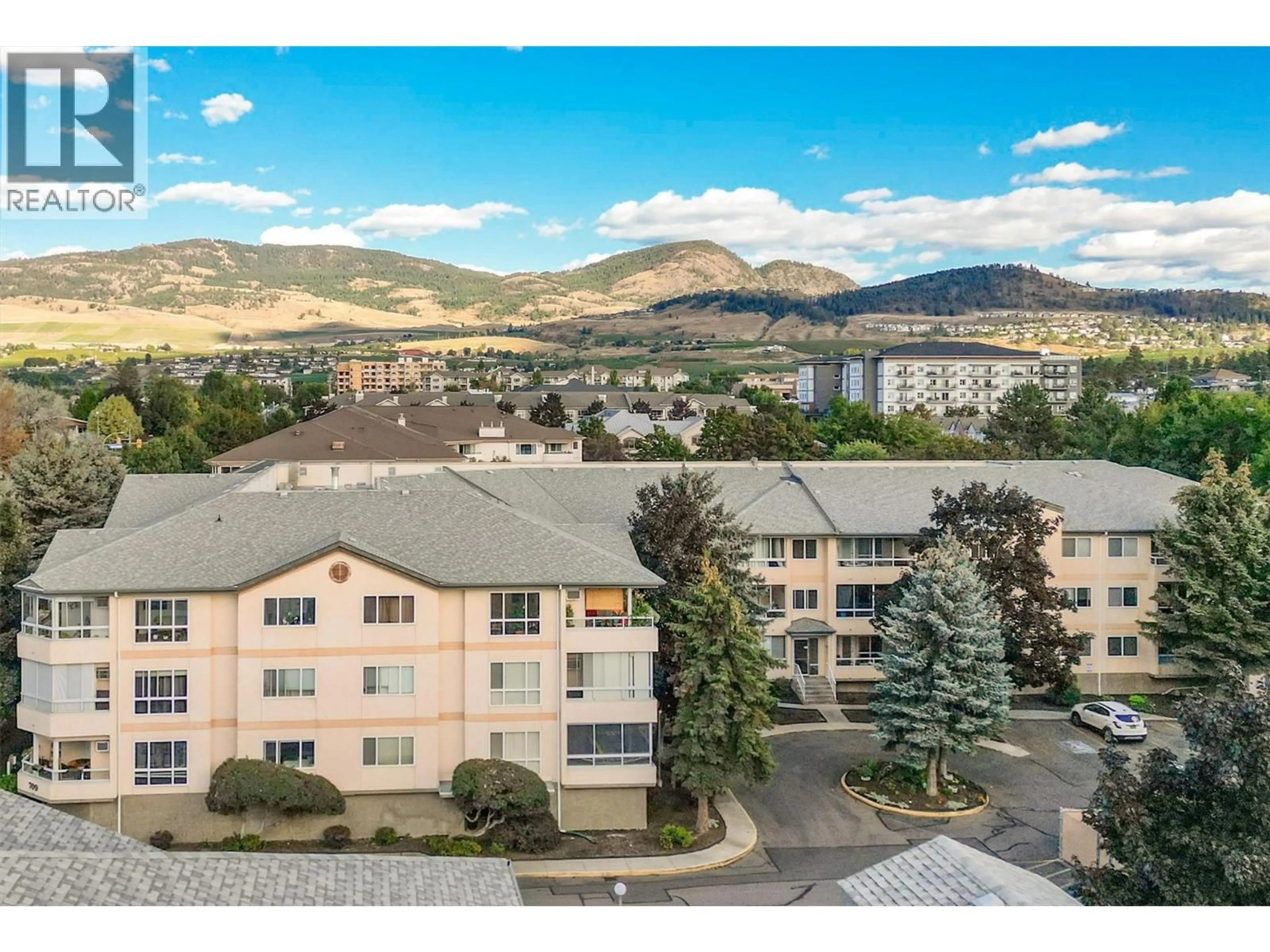 A pic from outside/outdoor area/front of a property/back of a property/a pic from drone, mountain view for 311 - 709 HOUGHTON ROAD, Kelowna British Columbia V1X7J7