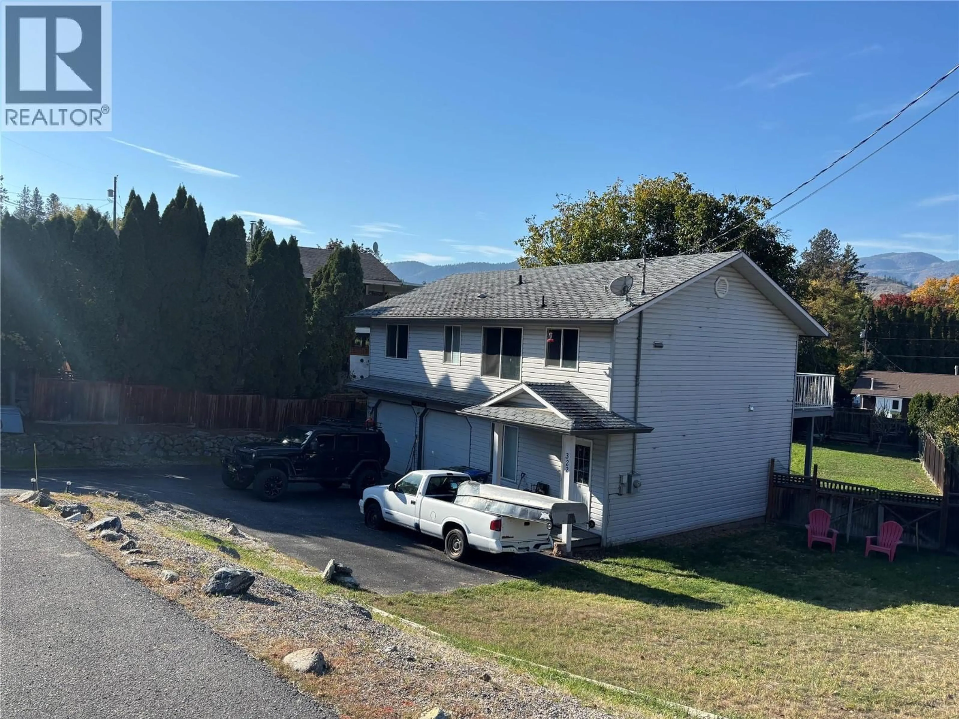 A pic from outside/outdoor area/front of a property/back of a property/a pic from drone, street for 322 CARMEL CRESCENT, Okanagan Falls British Columbia V0H1R5