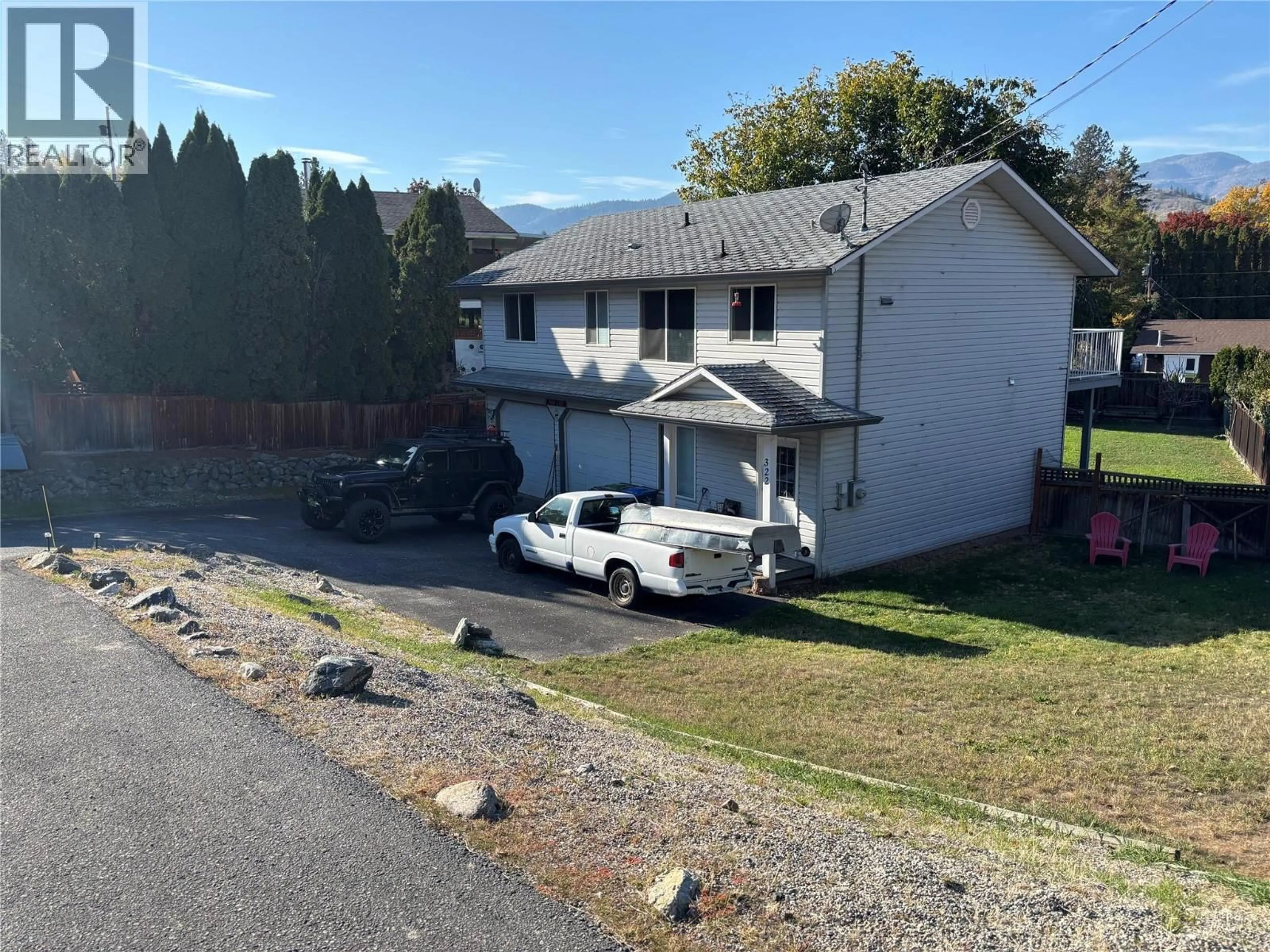 A pic from outside/outdoor area/front of a property/back of a property/a pic from drone, unknown for 322 CARMEL CRESCENT, Okanagan Falls British Columbia V0H1R5