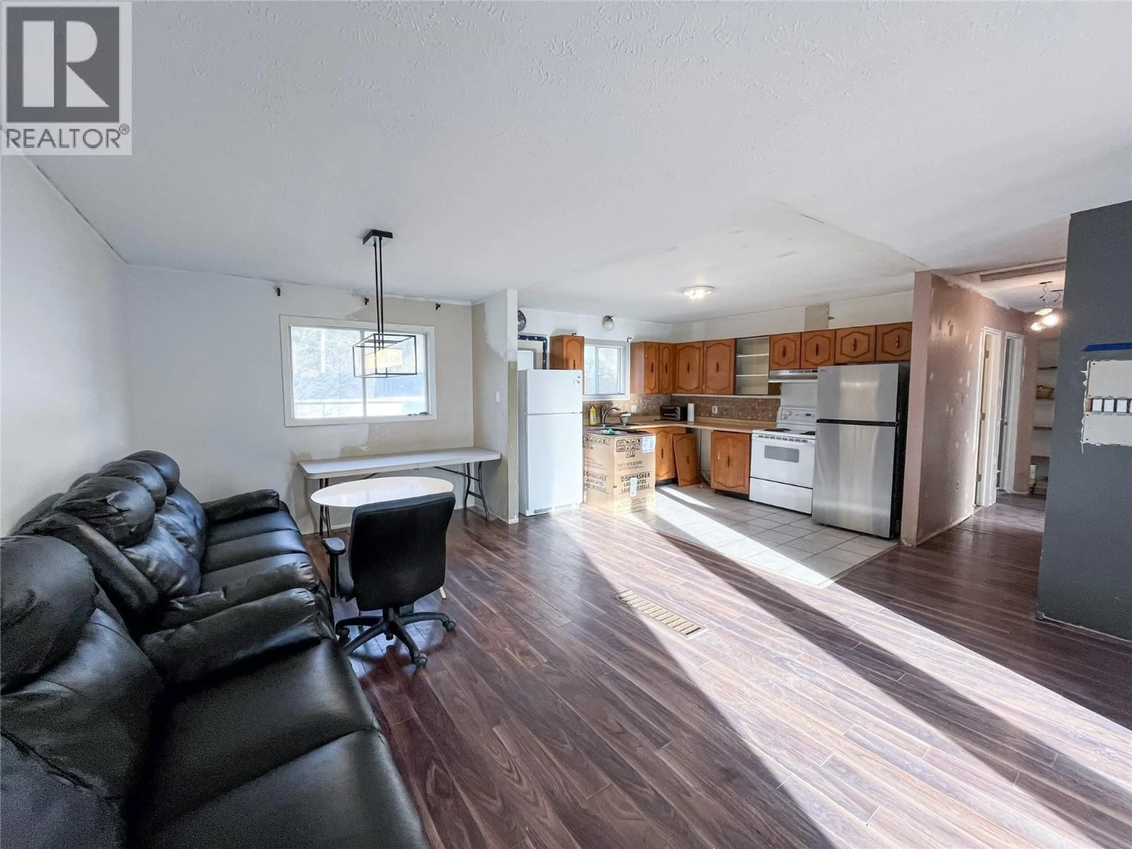 Open concept kitchen, wood/laminate floor for 36 KISKATINAW PLACE, Tumbler Ridge British Columbia V0C2W0