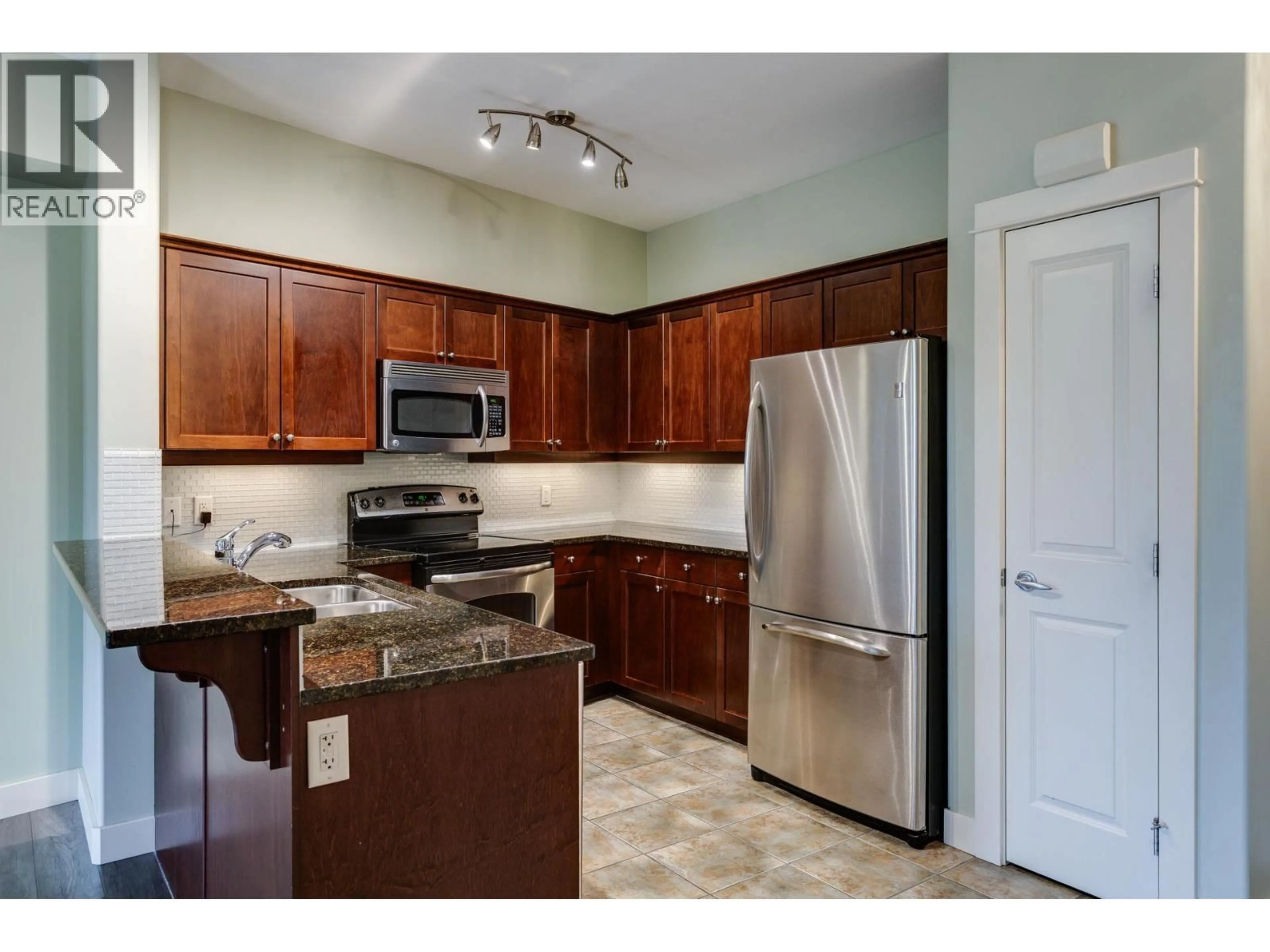 Standard kitchen, ceramic/tile floor for 219 - 2611 STILLWATER WAY, Lake Country British Columbia V4V2R3