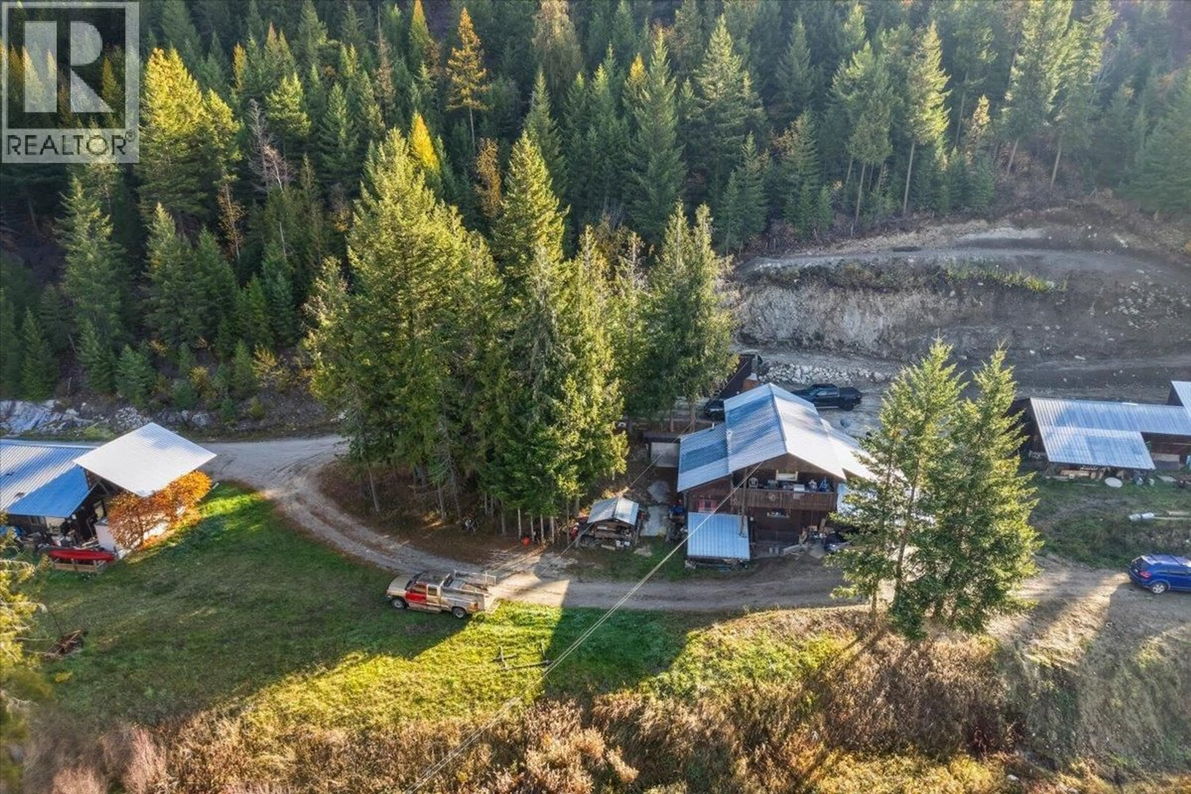 A pic from outside/outdoor area/front of a property/back of a property/a pic from drone, forest/trees view for 1880 HIGHWAY 6 OTHER, Lumby British Columbia V0E2G1