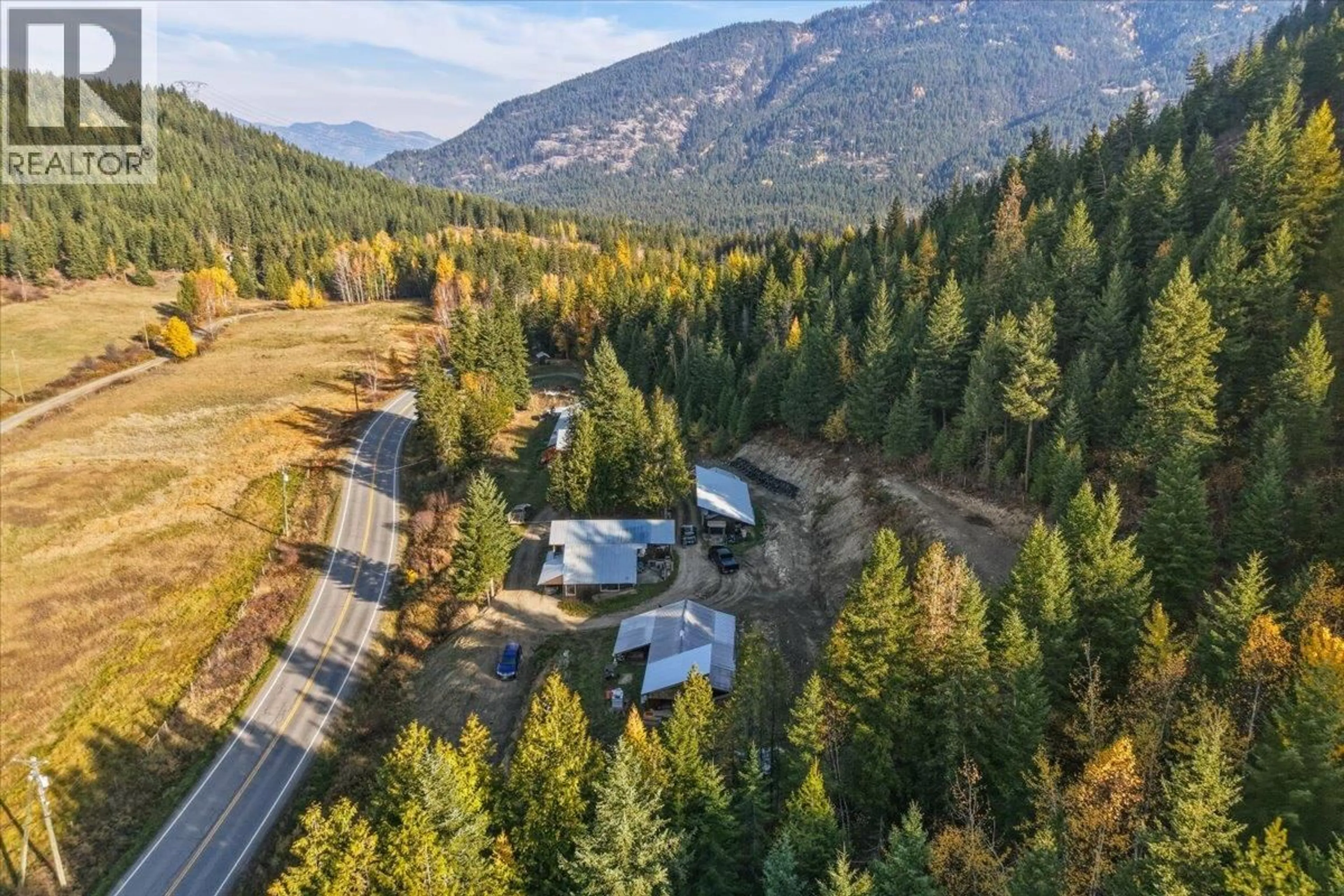 A pic from outside/outdoor area/front of a property/back of a property/a pic from drone, mountain view for 1880 HIGHWAY 6 OTHER, Lumby British Columbia V0E2G1