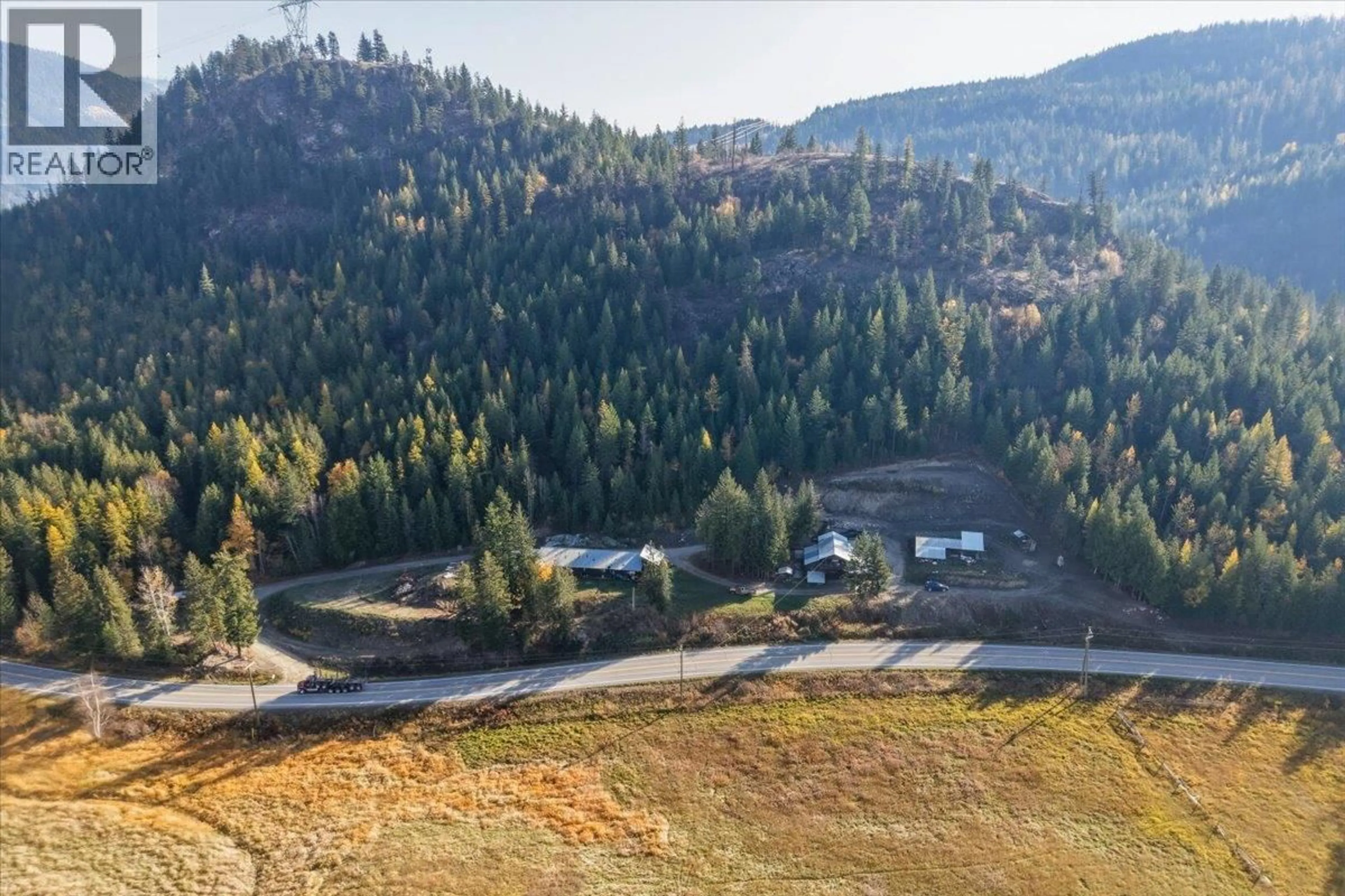 A pic from outside/outdoor area/front of a property/back of a property/a pic from drone, mountain view for 1880 HIGHWAY 6 OTHER, Lumby British Columbia V0E2G1