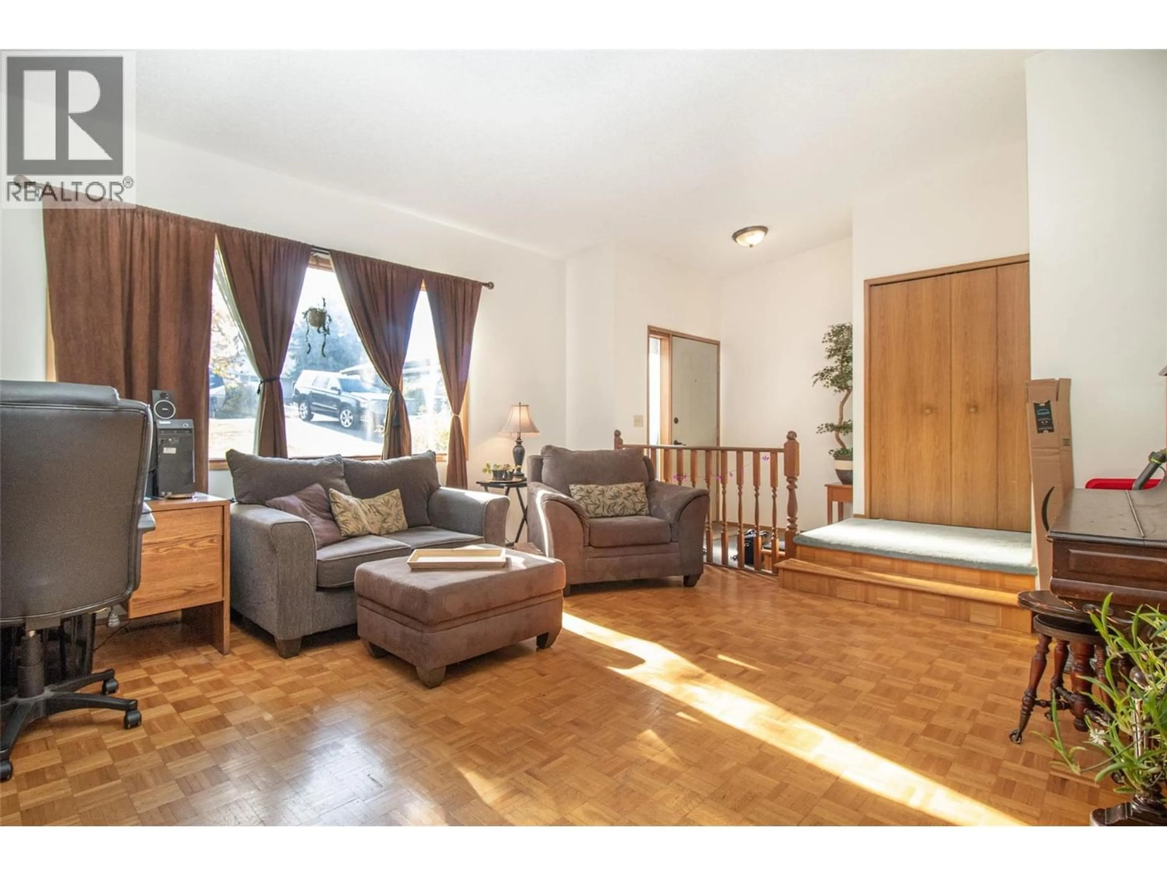 Living room with furniture, wood/laminate floor for 2970 SANDSTONE DRIVE, West Kelowna British Columbia V4T1T2