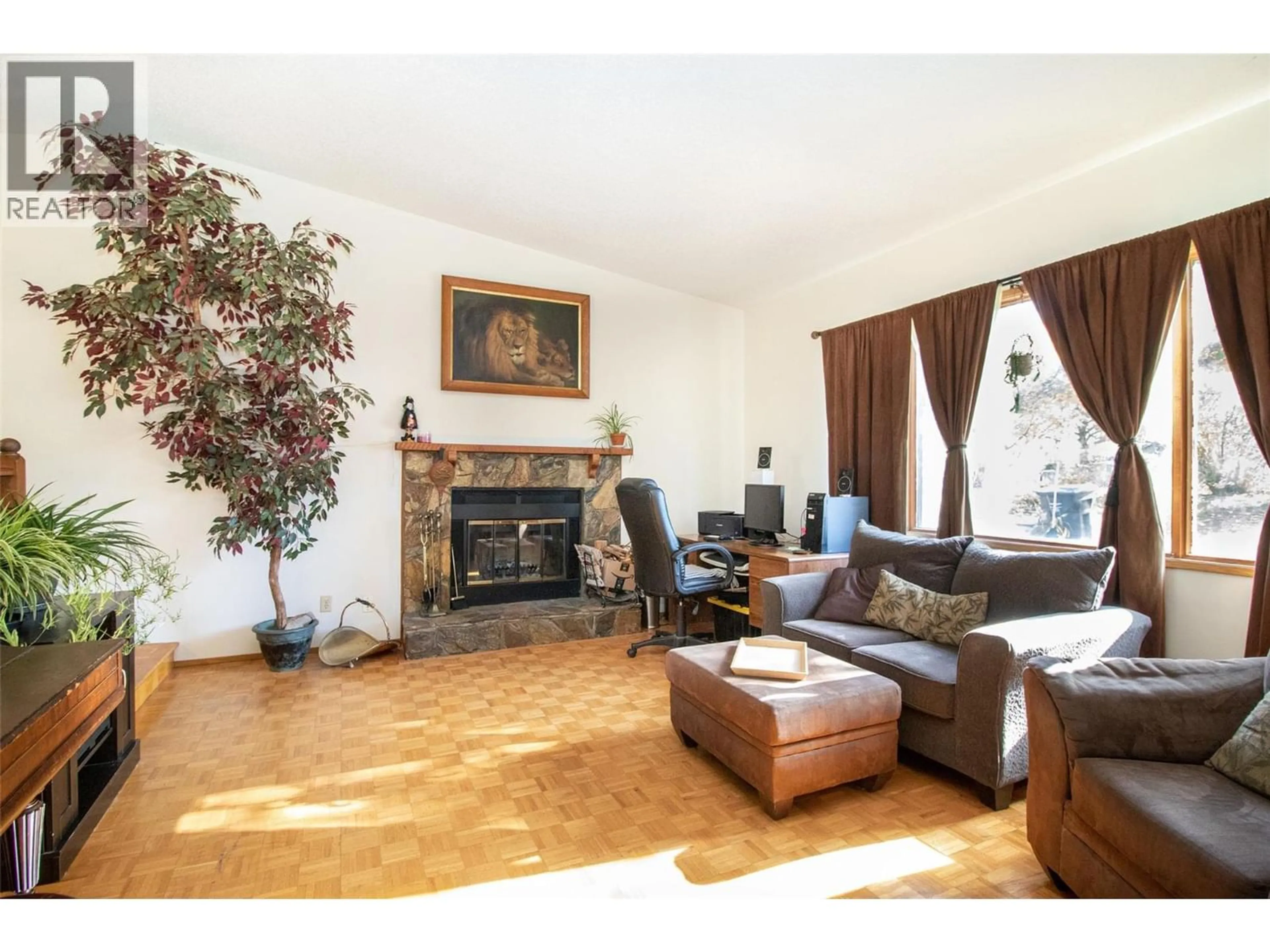 Living room with furniture, wood/laminate floor for 2970 SANDSTONE DRIVE, West Kelowna British Columbia V4T1T2
