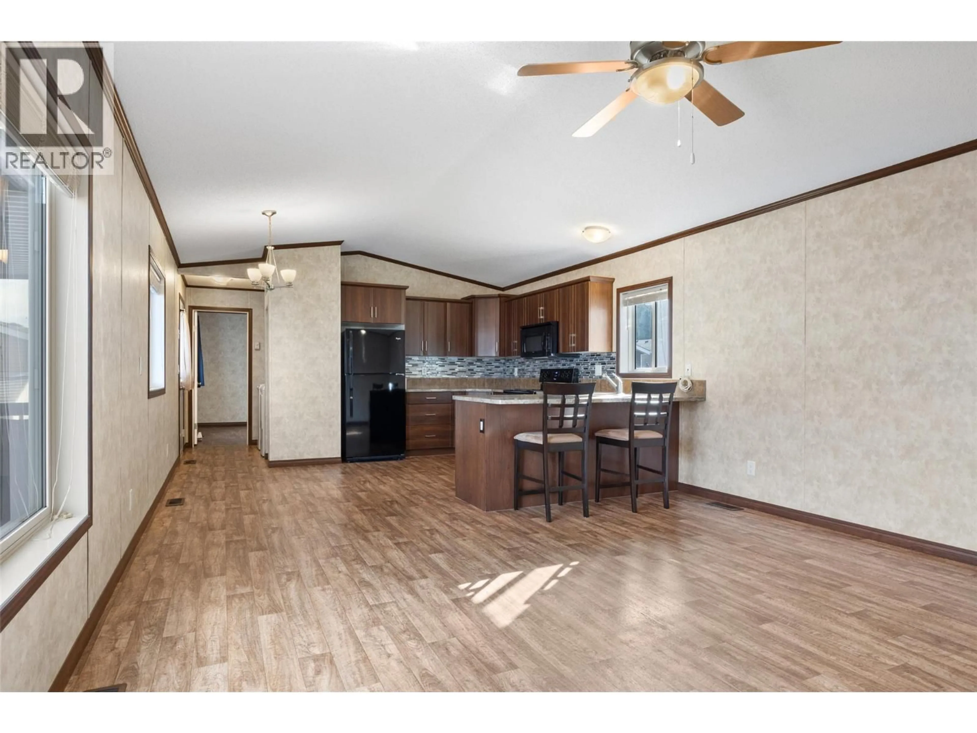 Open concept kitchen, wood/laminate floor for 27 - 7805 DALLAS DRIVE, Kamloops British Columbia V2C0E5