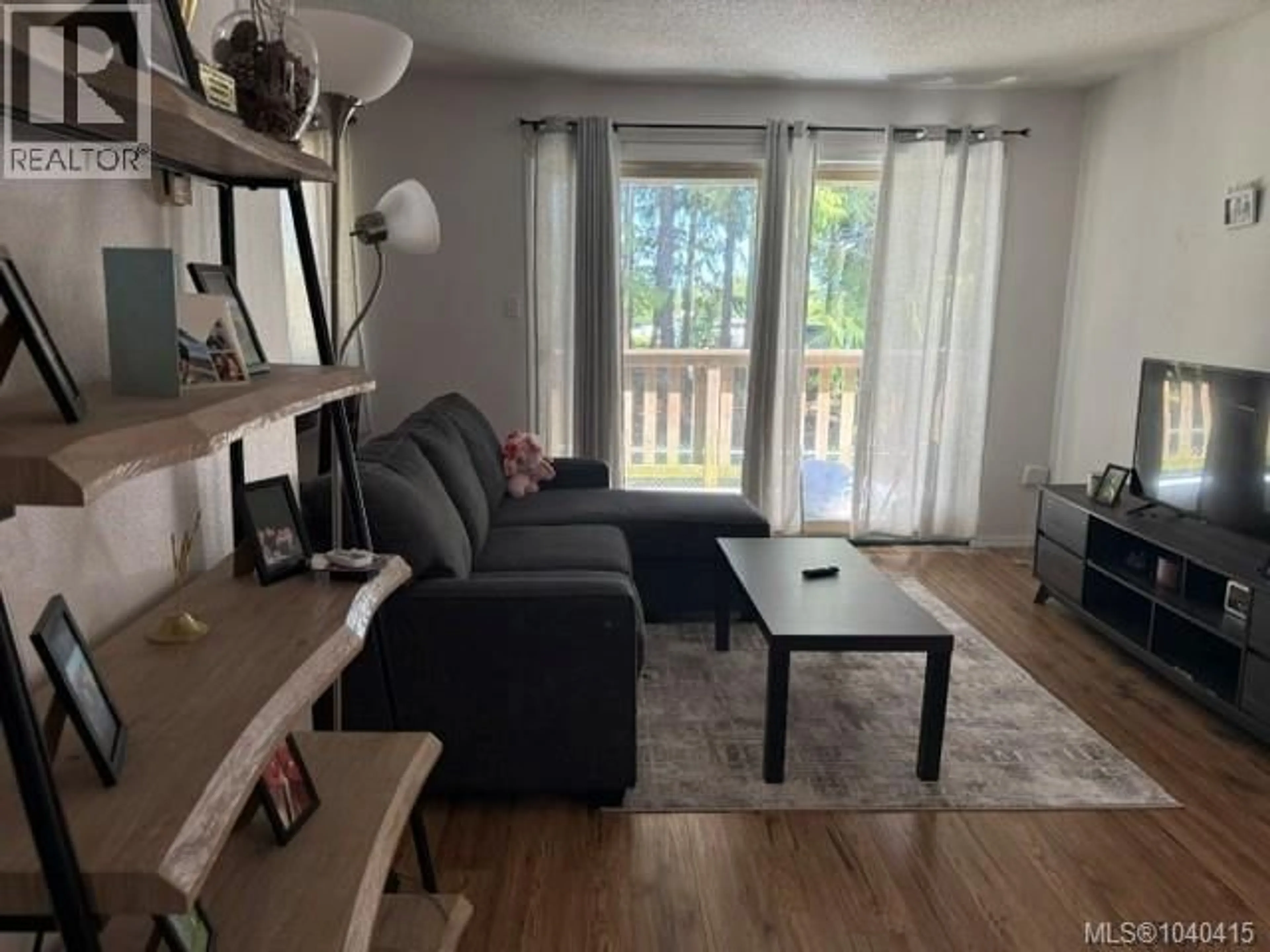 Living room with furniture, wood/laminate floor for 22 - 7077 HIGHLAND DRIVE, Port Hardy British Columbia V0N2P0