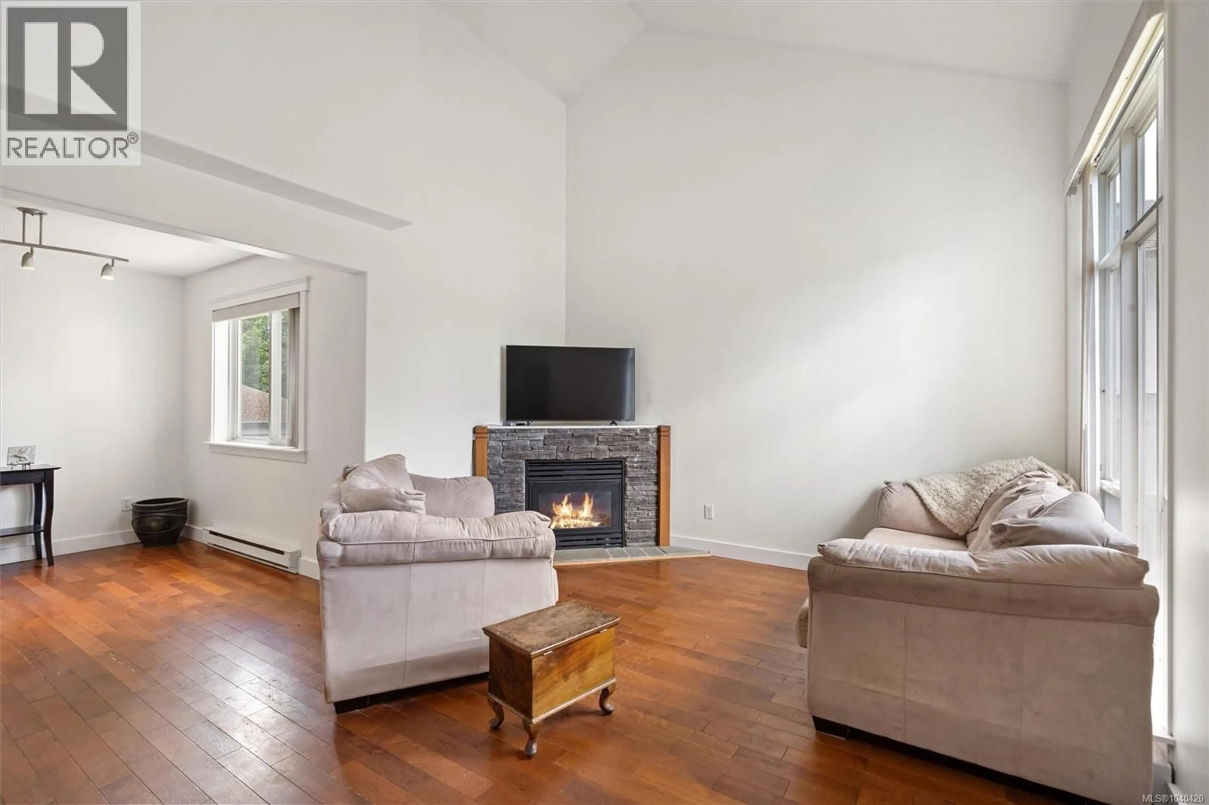 Living room with furniture, wood/laminate floor for 2466 GALLAND ROAD, Shawnigan Lake British Columbia V0R2W0
