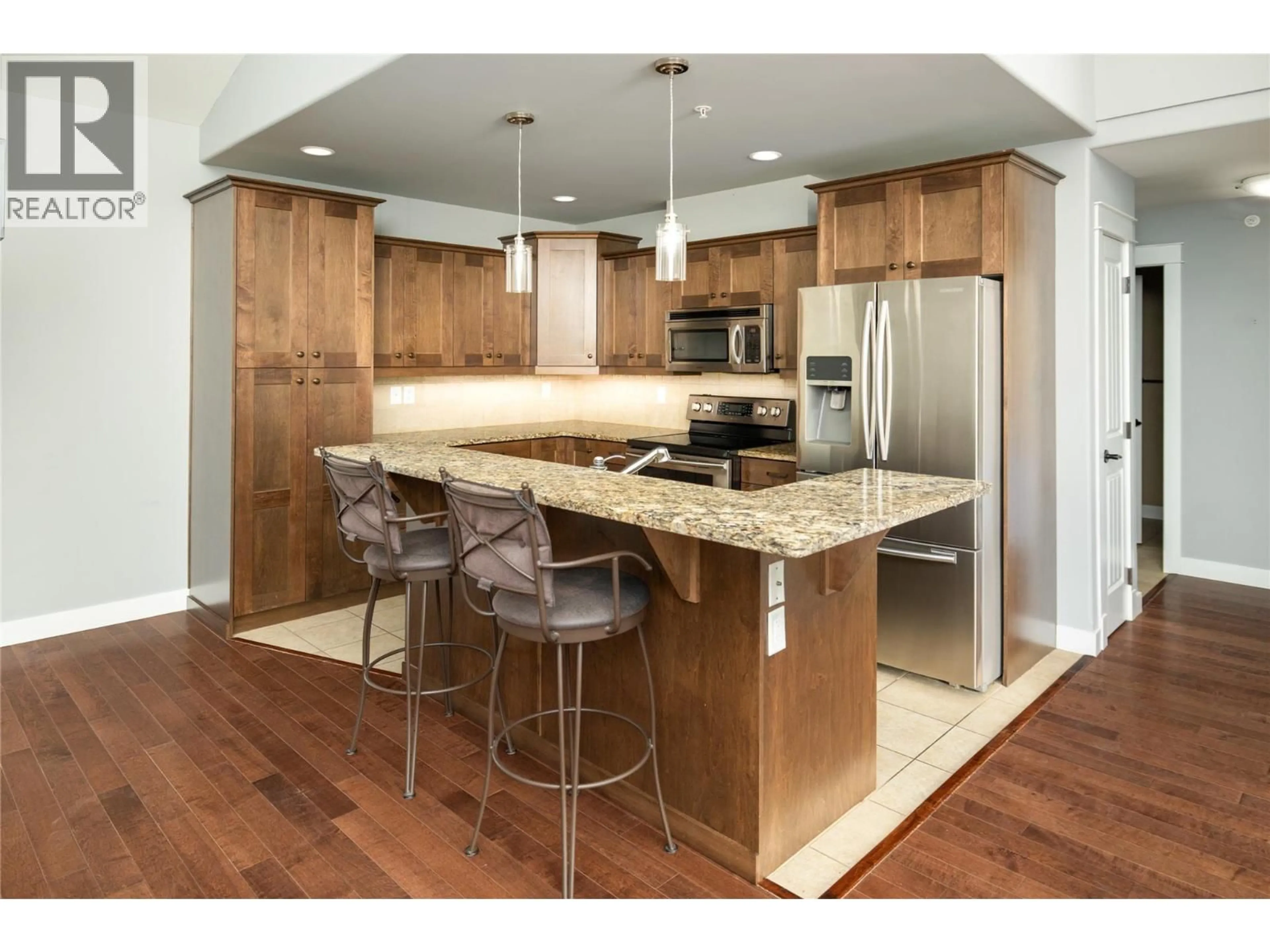 Open concept kitchen, wood/laminate floor for 405 - 2470 TUSCANY DRIVE, Shannon Lake British Columbia V4T3G8