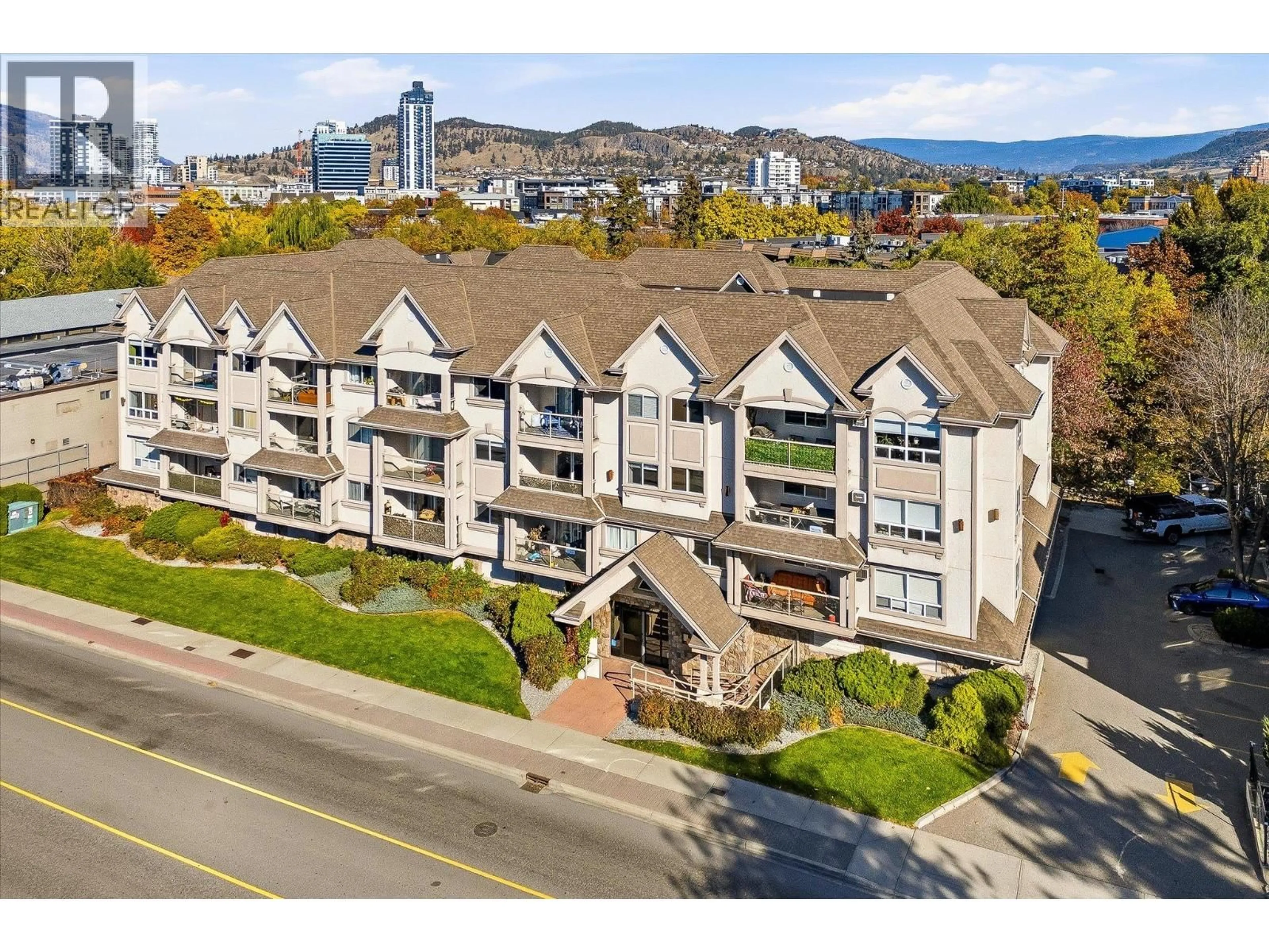 A pic from outside/outdoor area/front of a property/back of a property/a pic from drone, mountain view for 210 - 1965 PANDOSY STREET, Kelowna British Columbia V1Y1R9