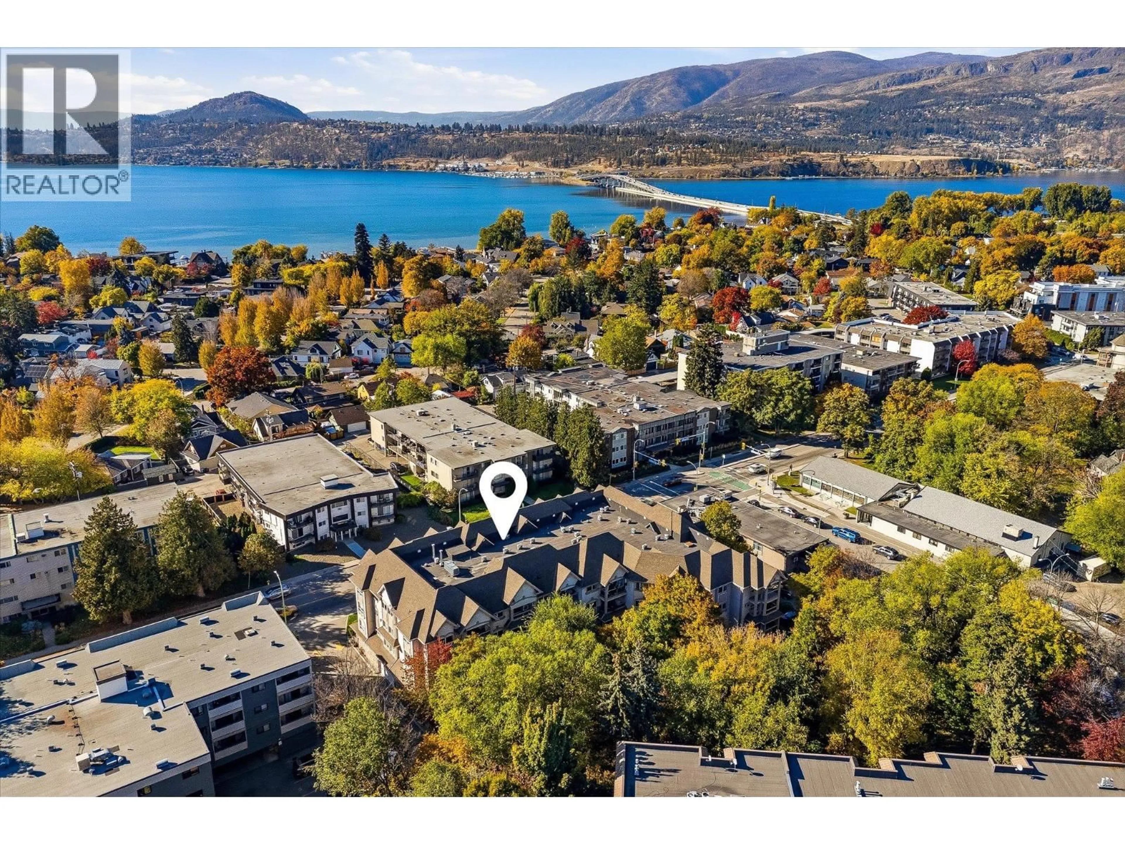 A pic from outside/outdoor area/front of a property/back of a property/a pic from drone, mountain view for 210 - 1965 PANDOSY STREET, Kelowna British Columbia V1Y1R9