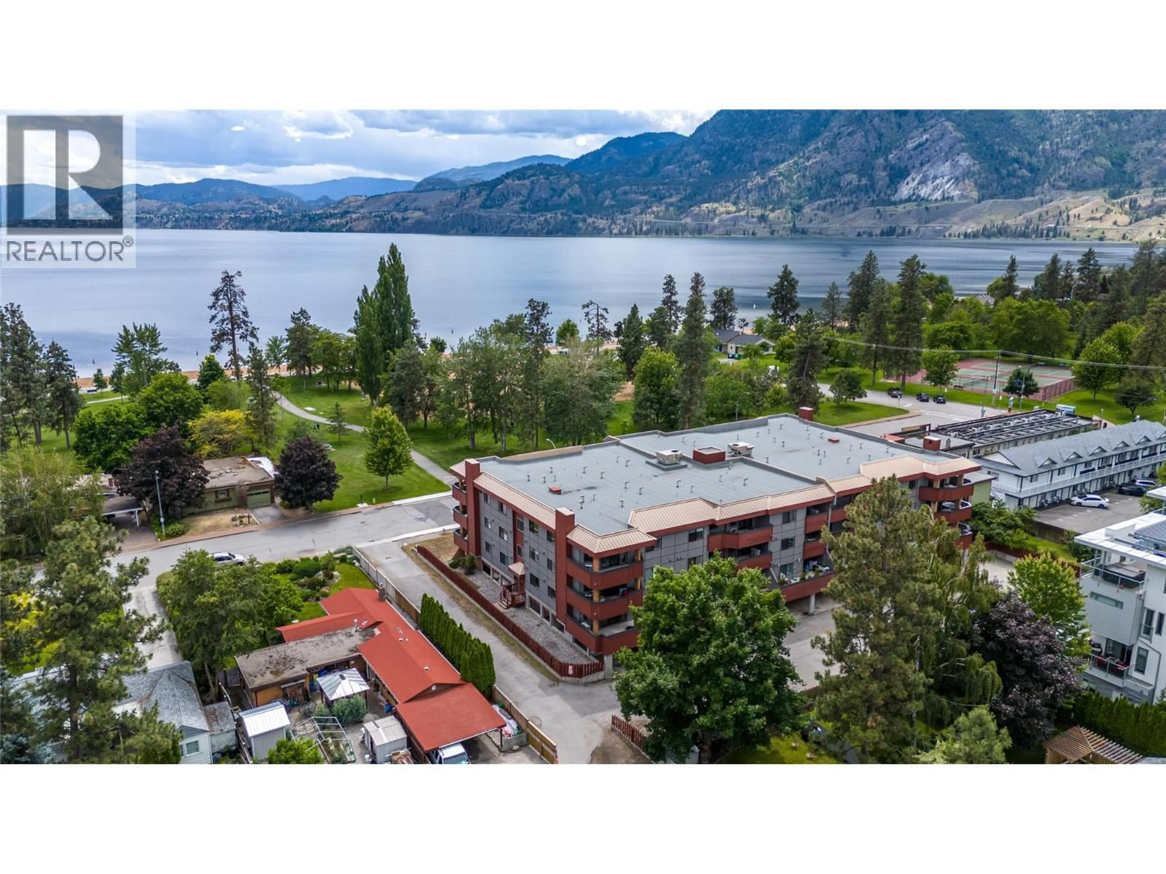A pic from outside/outdoor area/front of a property/back of a property/a pic from drone, water/lake/river/ocean view for 102 - 217 ELM AVENUE, Penticton British Columbia V2A3W1