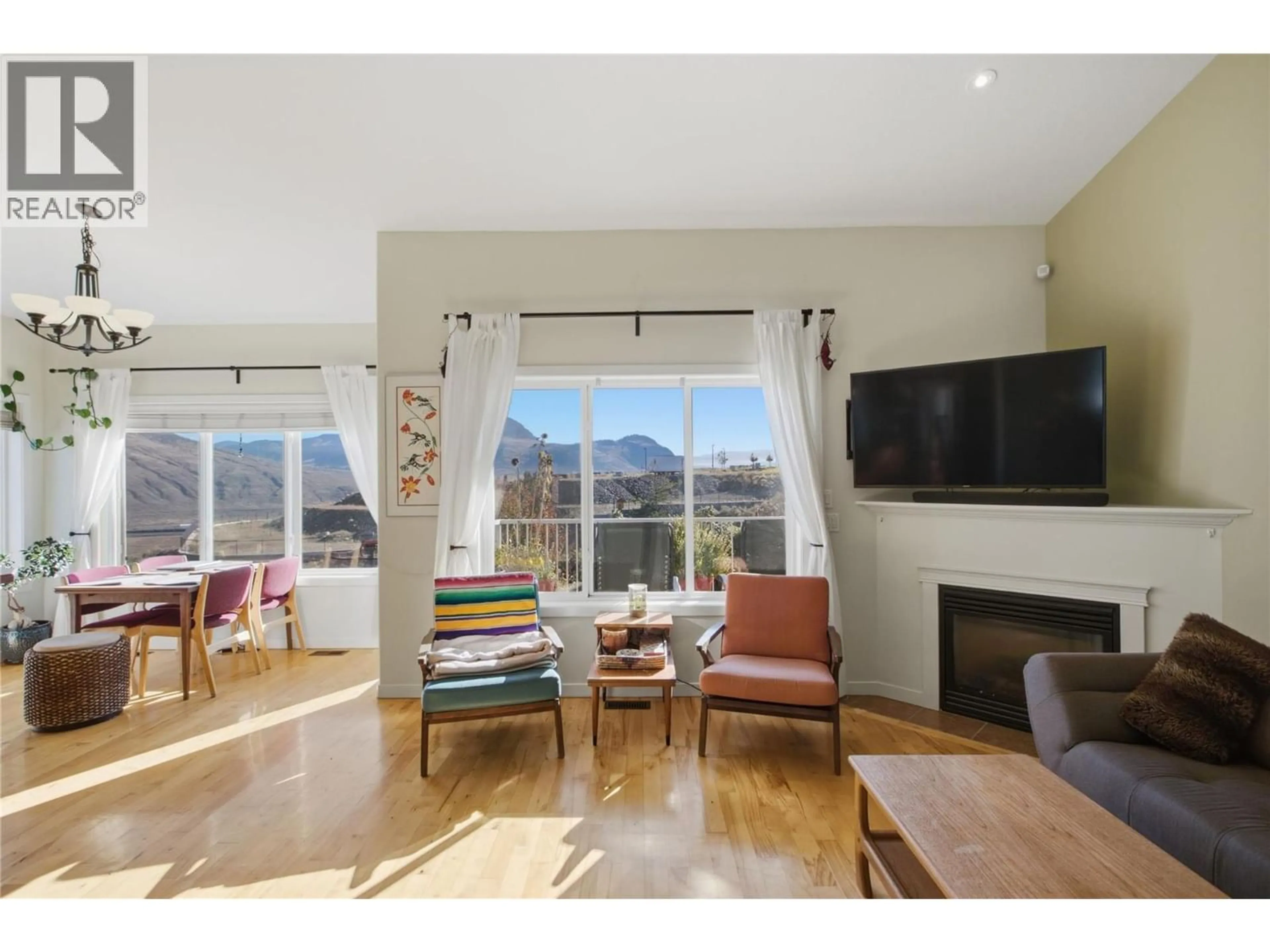 Living room with furniture, wood/laminate floor for 2060 GRASSLANDS BOULEVARD, Kamloops British Columbia V2B0A6