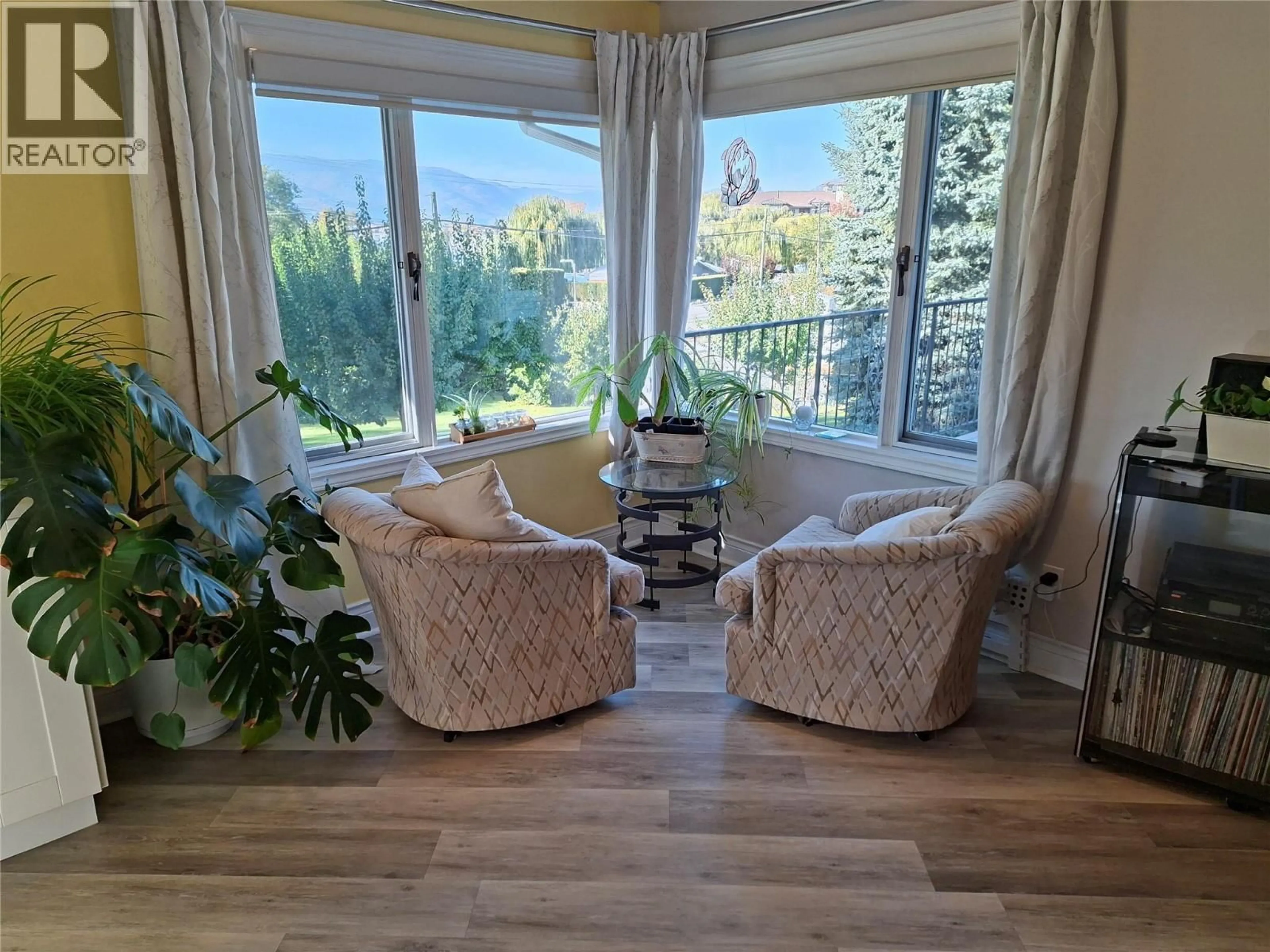 Living room with furniture, wood/laminate floor for 4306 36TH AVENUE, Osoyoos British Columbia V0H1V6