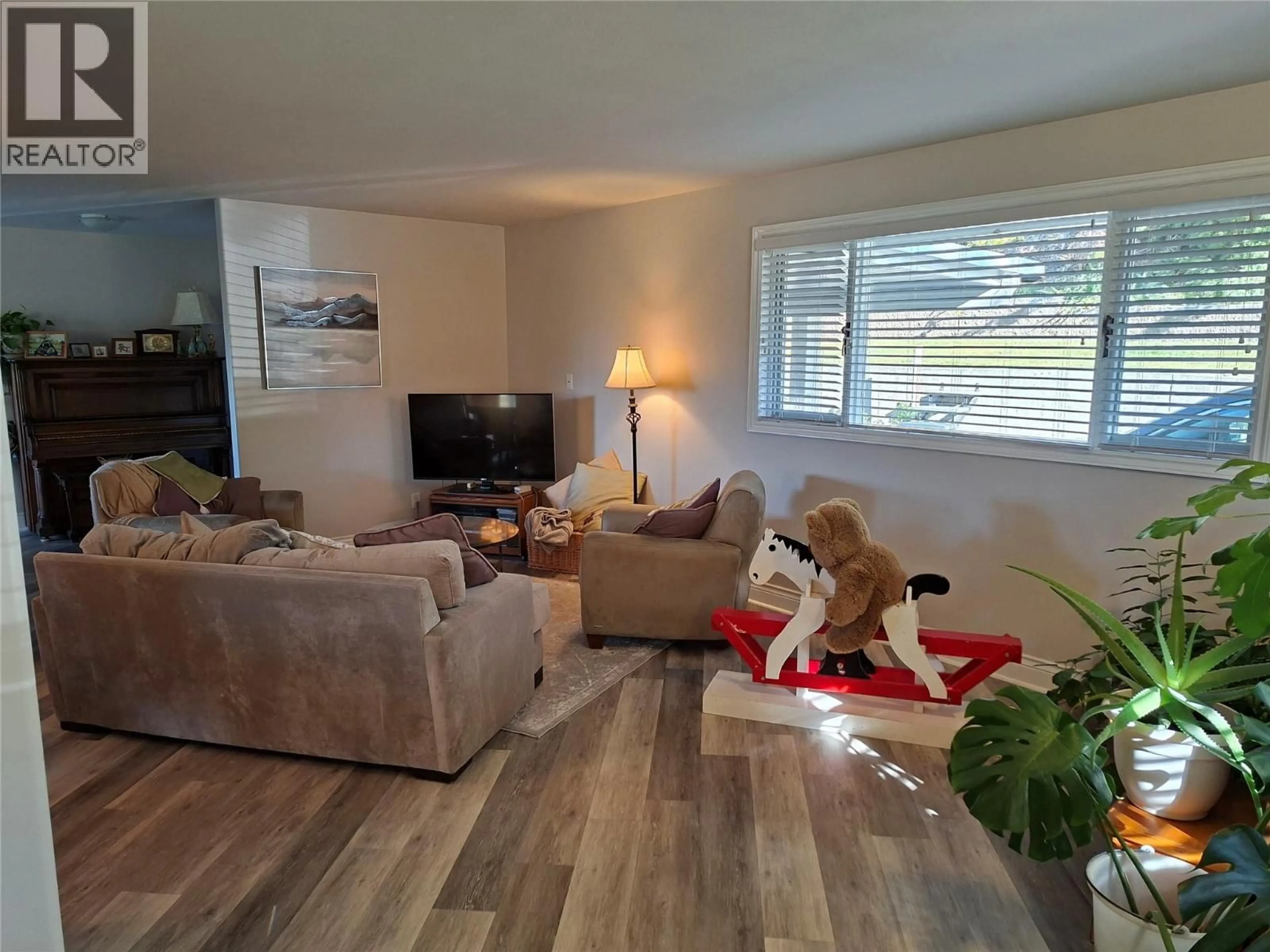 Living room with furniture, wood/laminate floor for 4306 36TH AVENUE, Osoyoos British Columbia V0H1V6