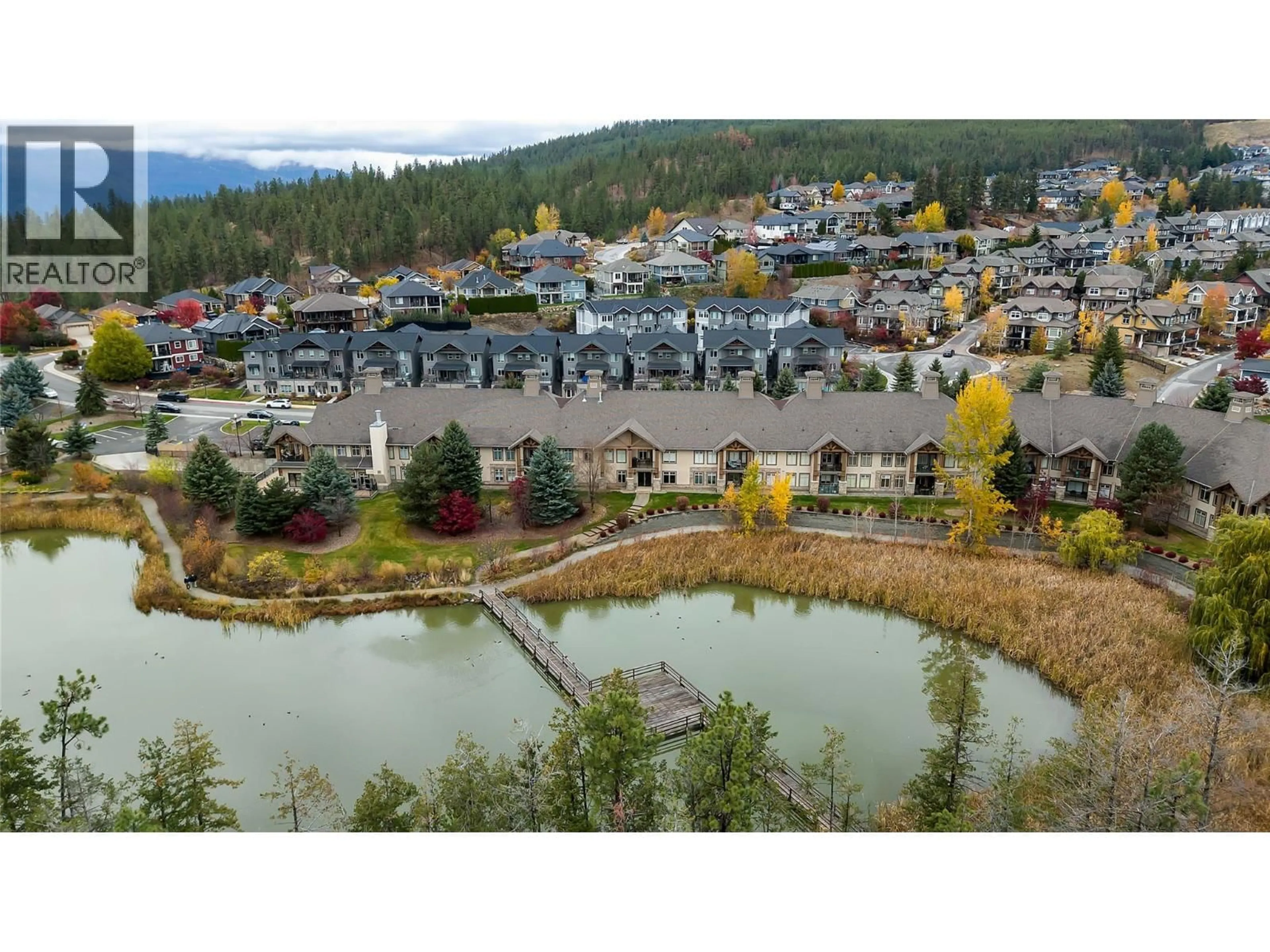 A pic from outside/outdoor area/front of a property/back of a property/a pic from drone, water/lake/river/ocean view for 210 - 2611 STILLWATER WAY, Lake Country British Columbia V4V2P3