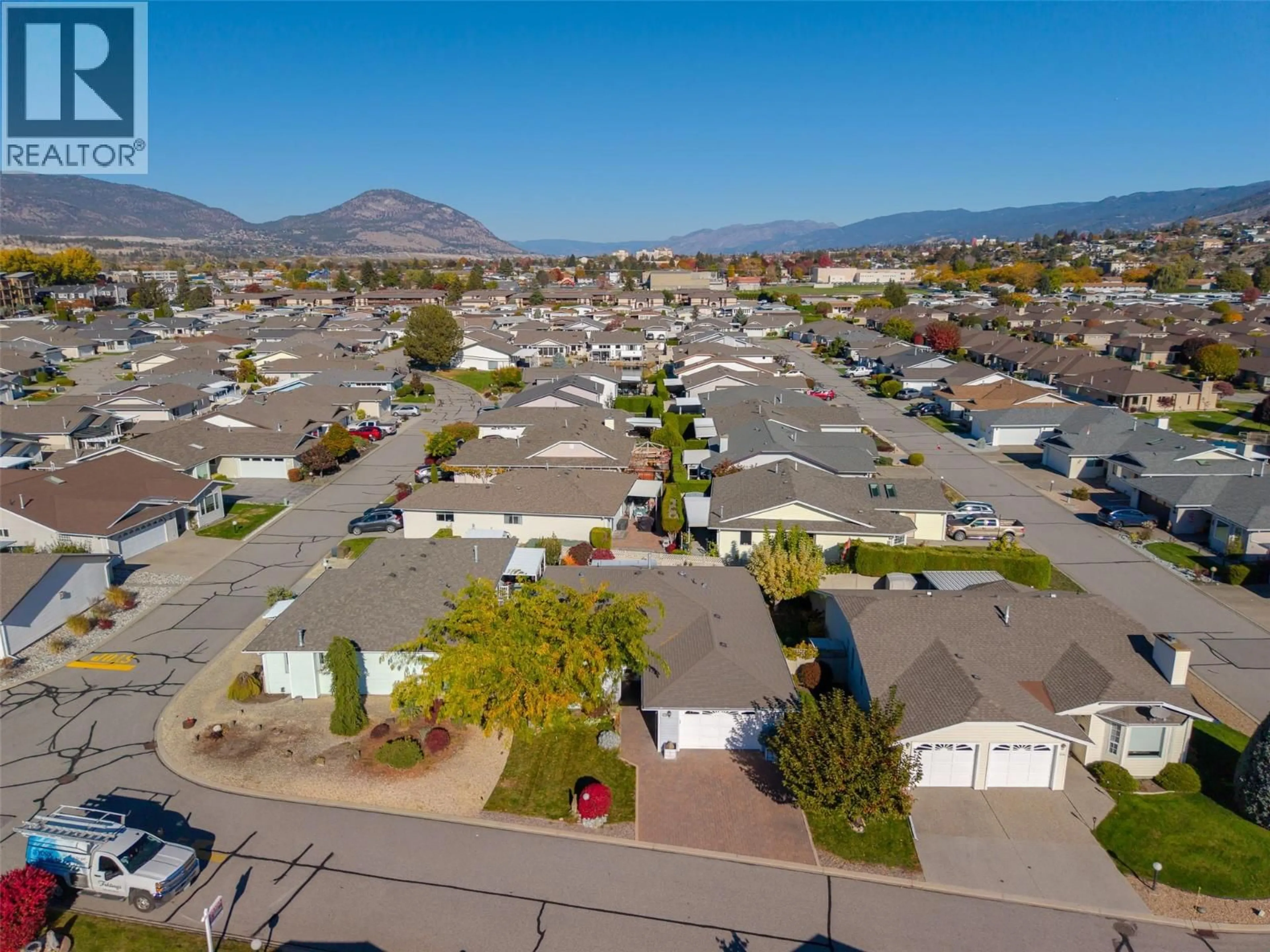 A pic from outside/outdoor area/front of a property/back of a property/a pic from drone, mountain view for 110 - 3400 WILSON STREET, Penticton British Columbia V2A8E3