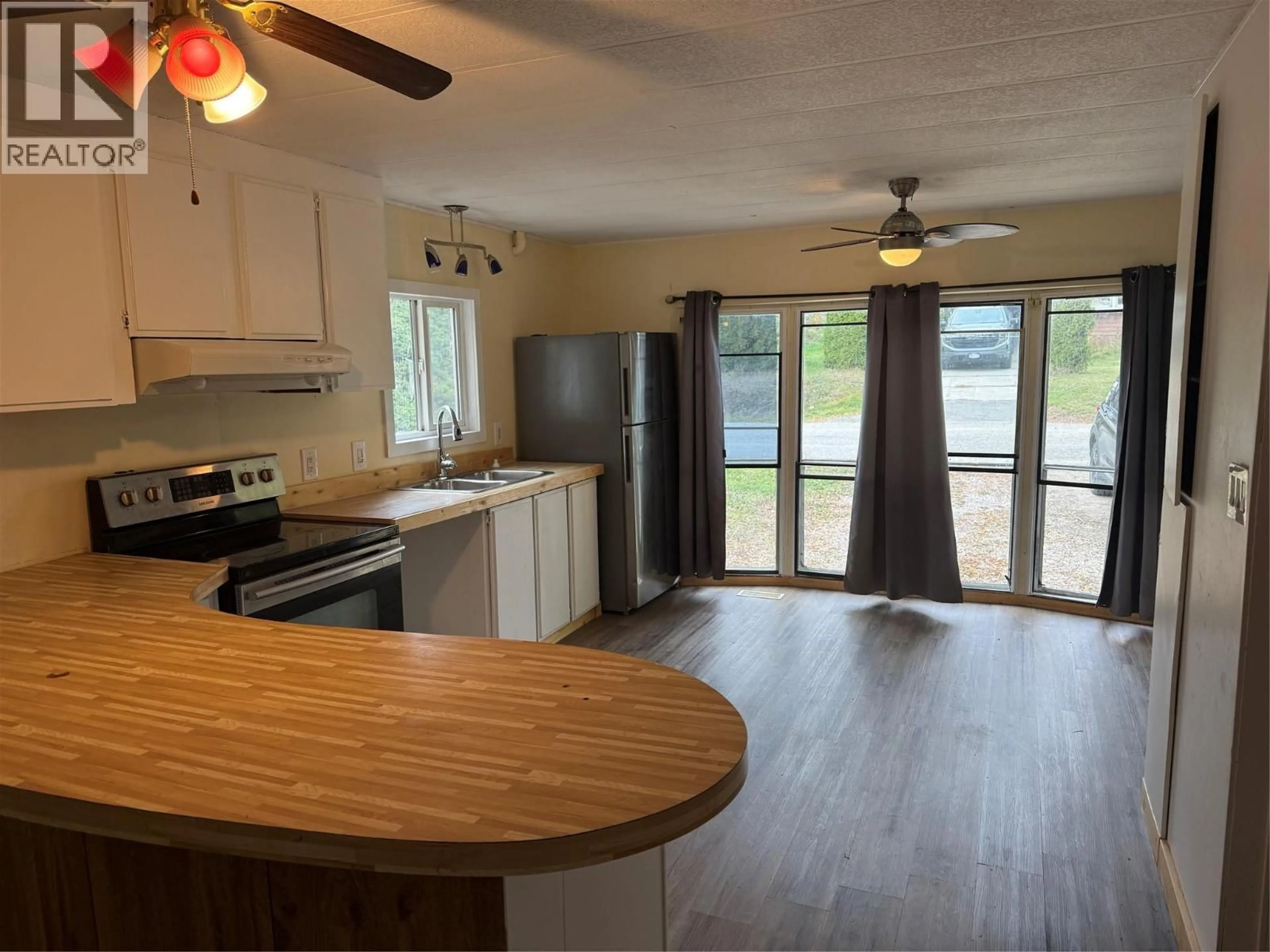 Open concept kitchen, wood/laminate floor for 405 3RD AVENUE, Castlegar British Columbia V1N1Y1