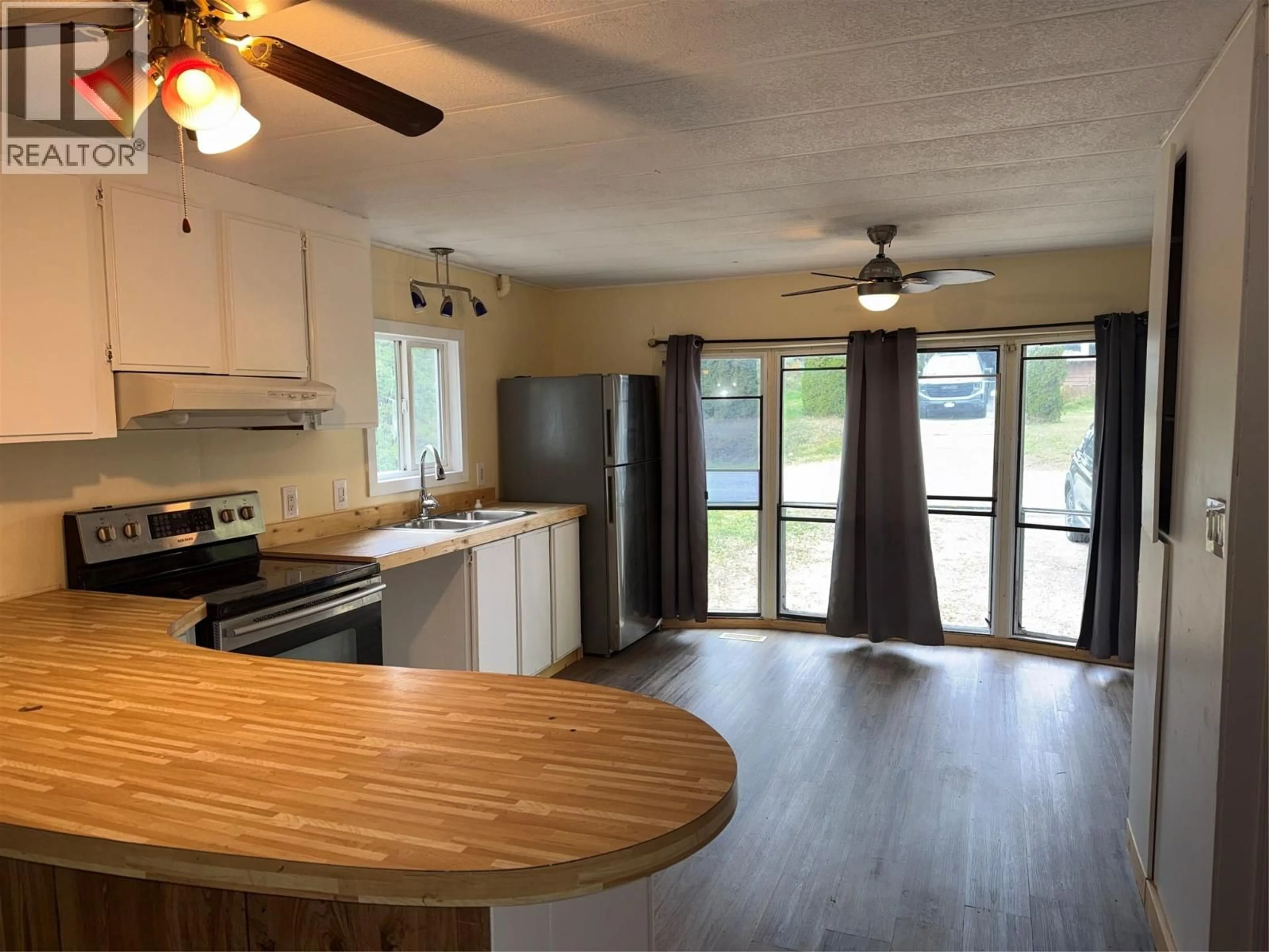 Open concept kitchen, wood/laminate floor for 405 3RD AVENUE, Castlegar British Columbia V1N1Y1