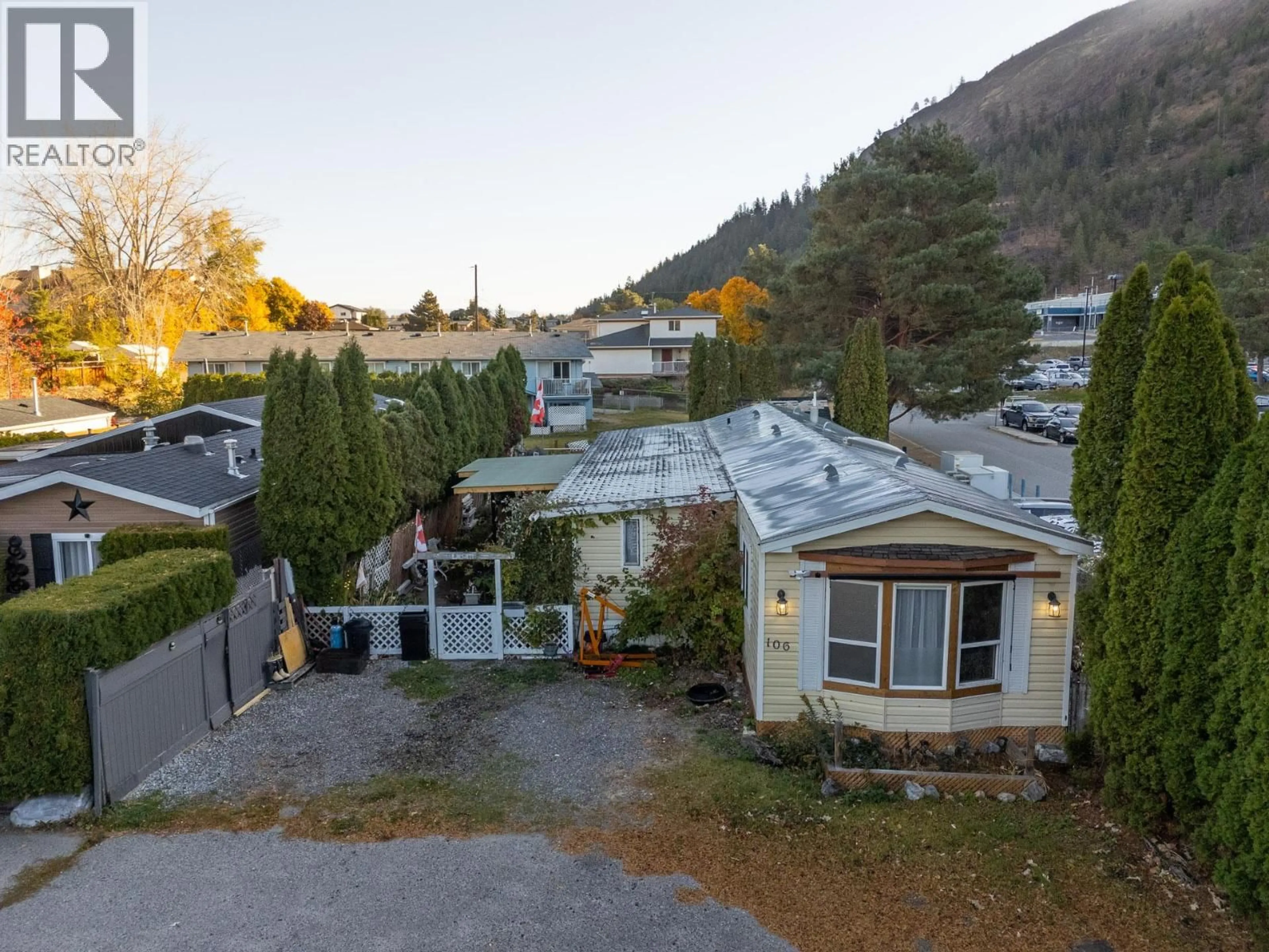 A pic from outside/outdoor area/front of a property/back of a property/a pic from drone, mountain view for 106 - 1699 ROSS ROAD, West Kelowna British Columbia V1Z1L8
