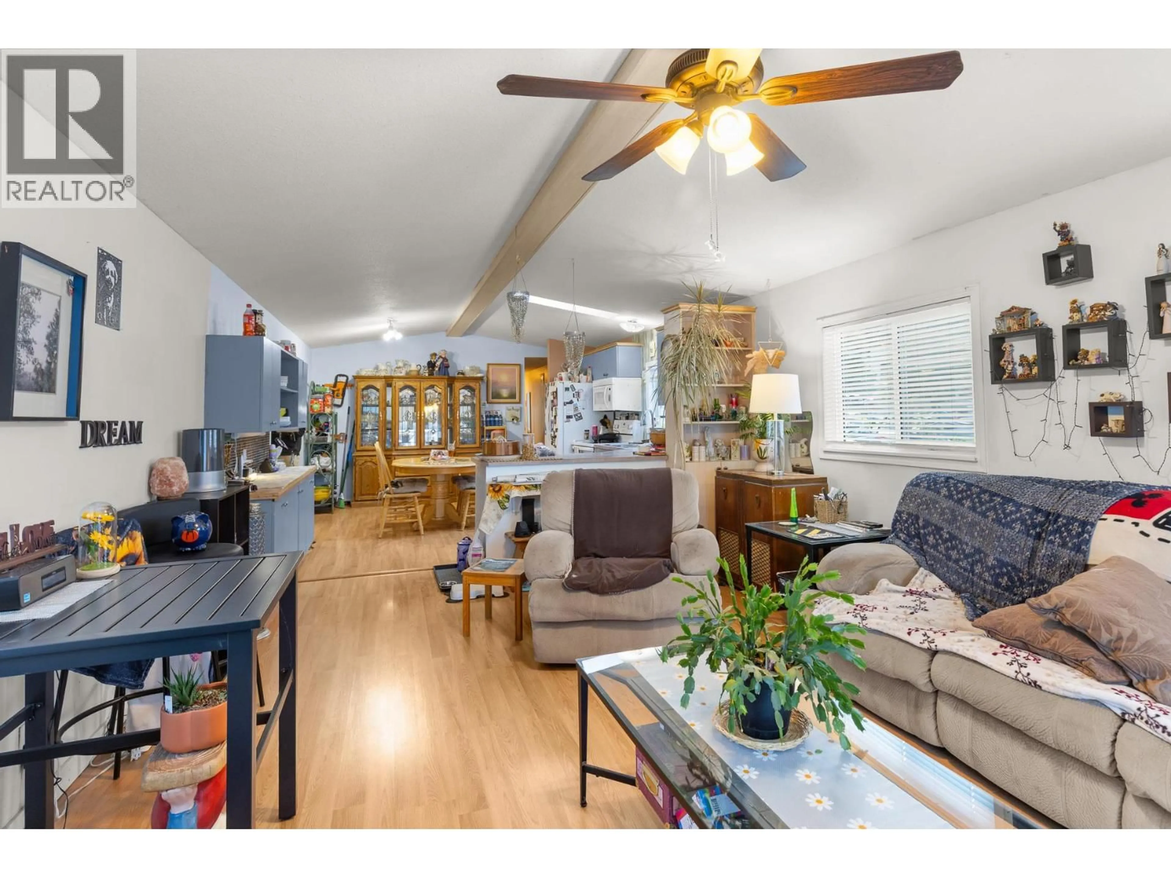 Living room with furniture, wood/laminate floor for 106 - 1699 ROSS ROAD, West Kelowna British Columbia V1Z1L8