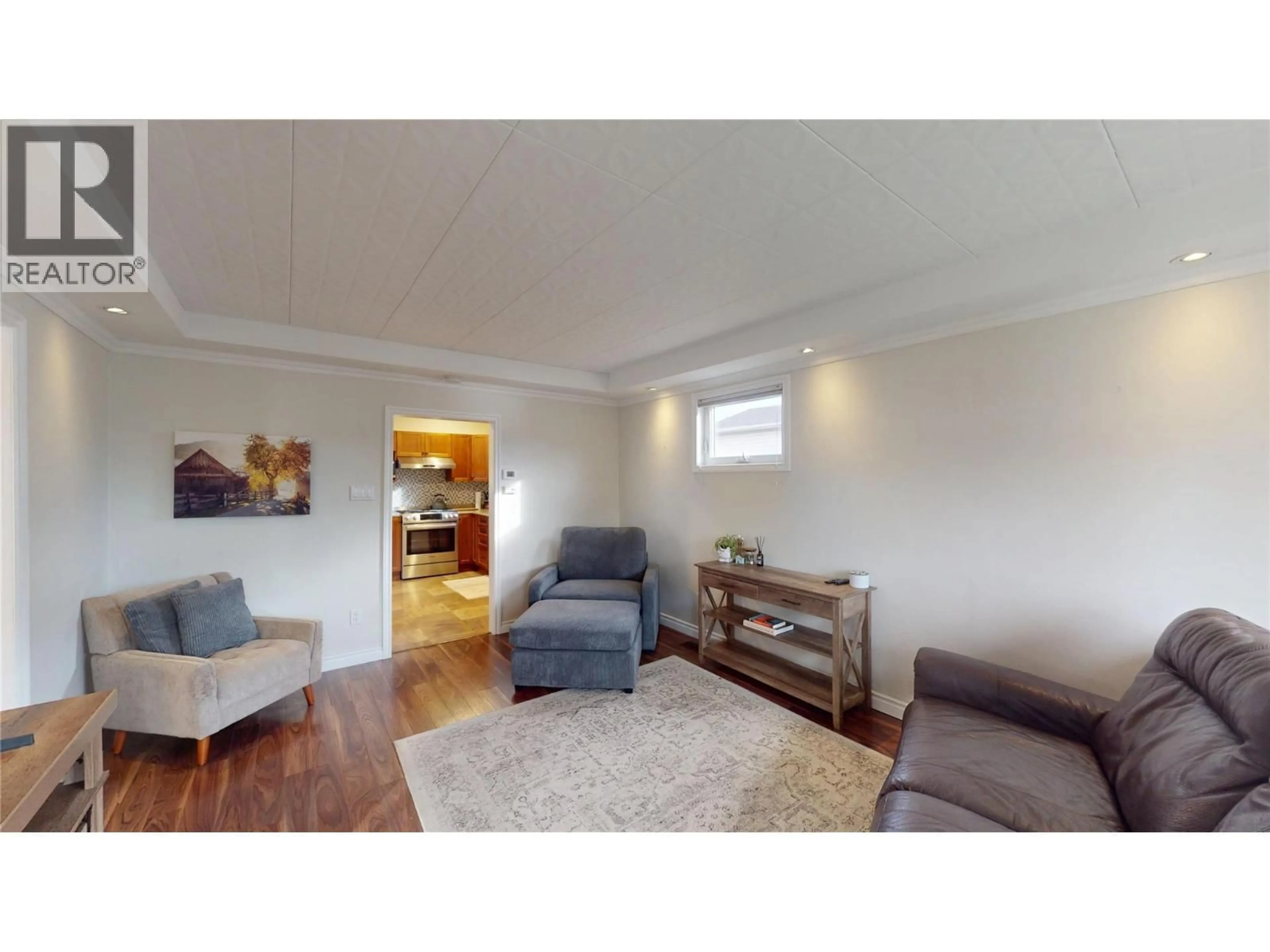 Living room with furniture, wood/laminate floor for 1600 4TH STREET NORTH, Cranbrook British Columbia V1C3L7