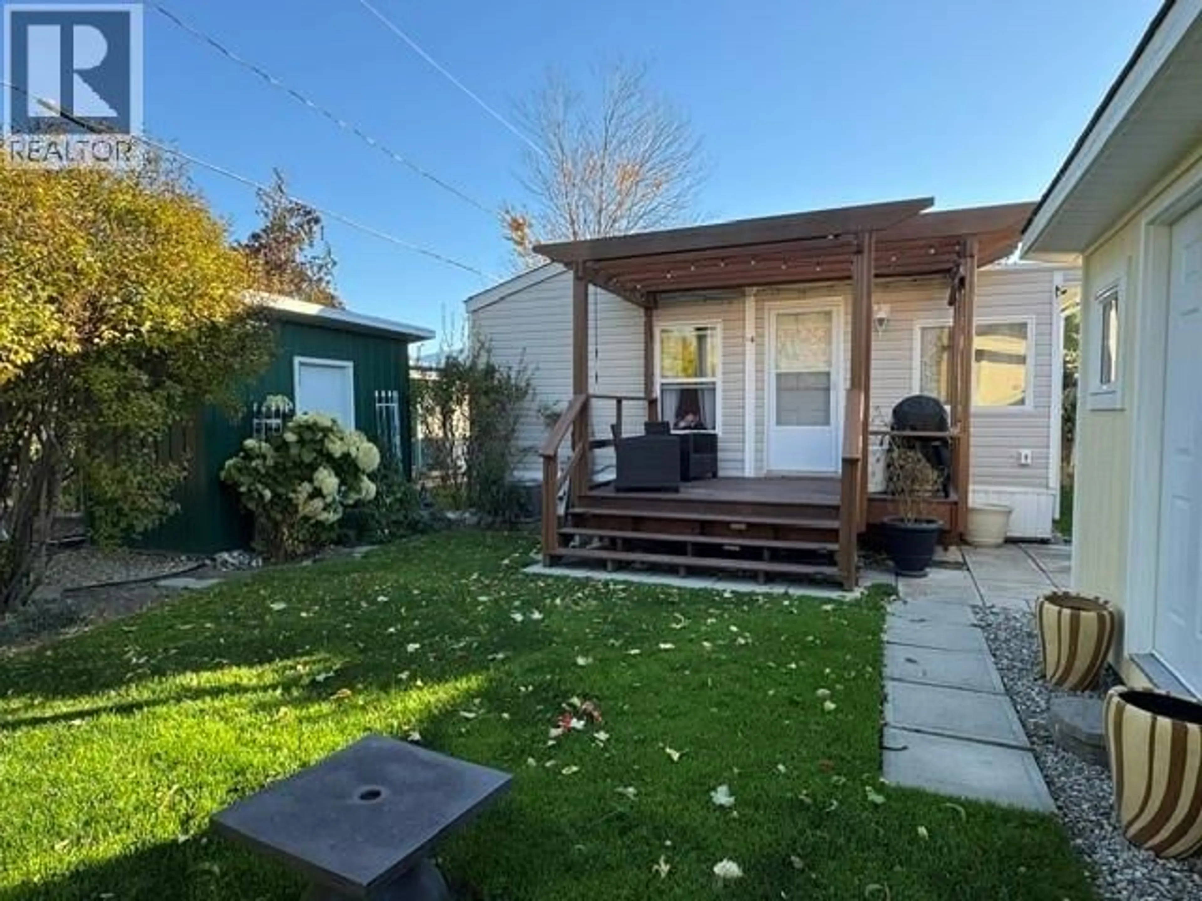 A pic from outside/outdoor area/front of a property/back of a property/a pic from drone, street for 16 - 8712 STEUART STREET, Summerland British Columbia V0H1Z6