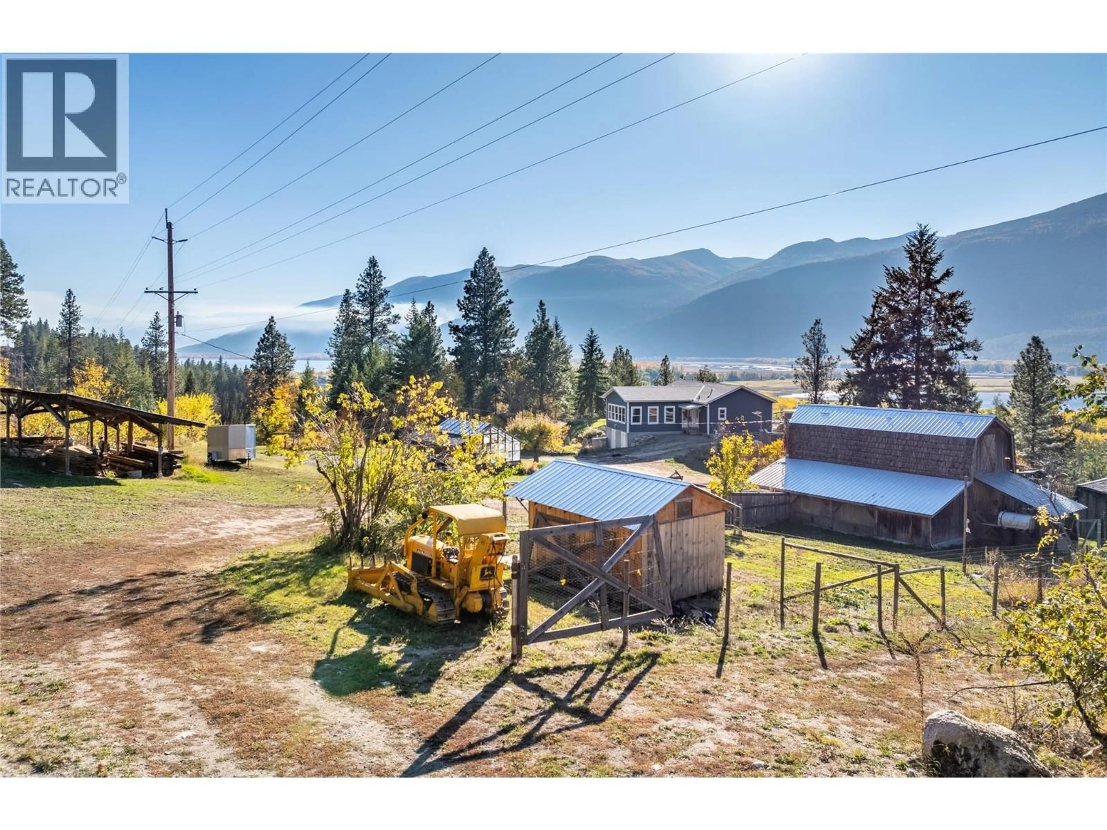 A pic from outside/outdoor area/front of a property/back of a property/a pic from drone, mountain view for 8732 3A HIGHWAY, Sirdar British Columbia V0B2N1