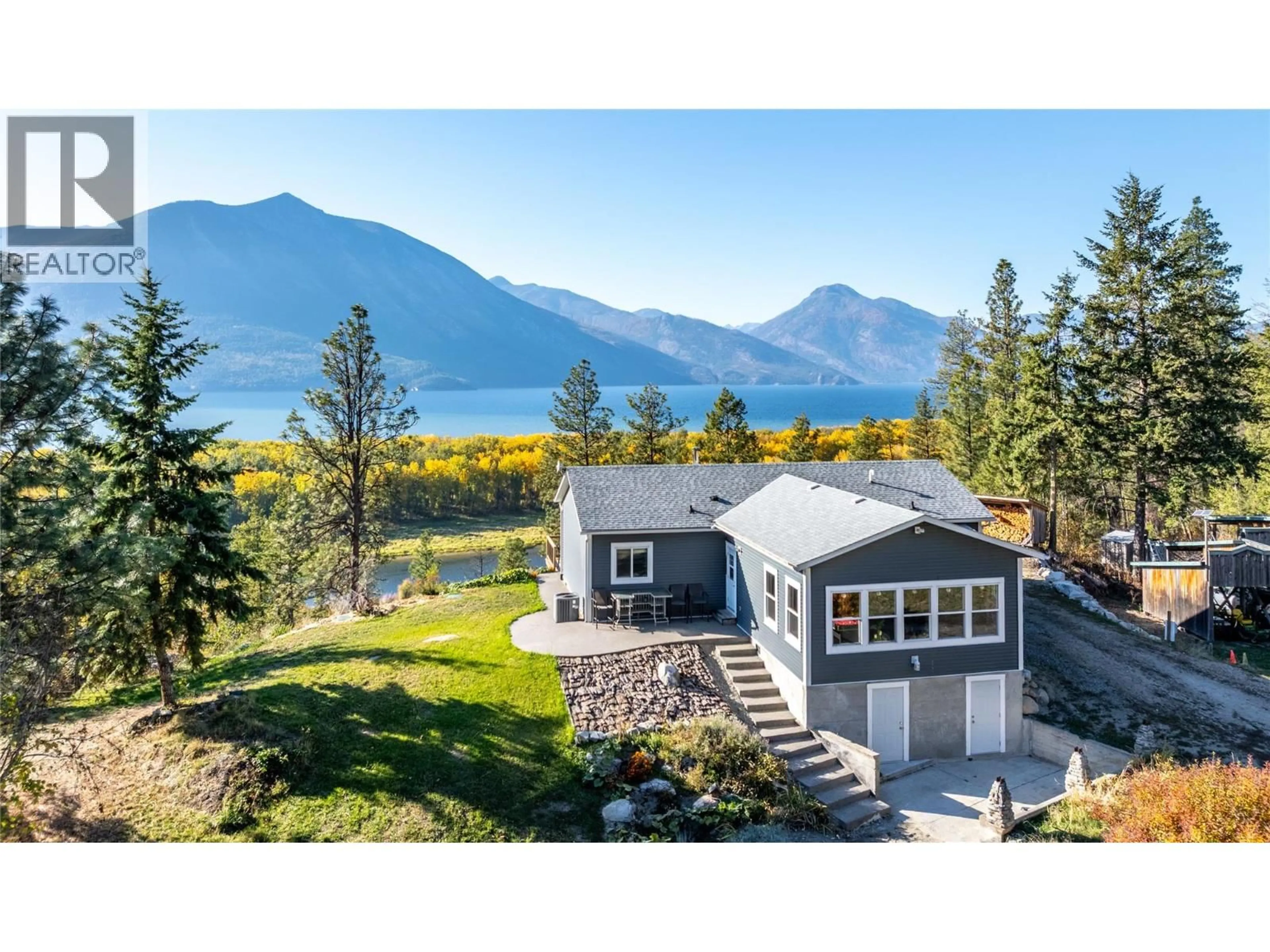 A pic from outside/outdoor area/front of a property/back of a property/a pic from drone, water/lake/river/ocean view for 8732 3A HIGHWAY, Sirdar British Columbia V0B2N1