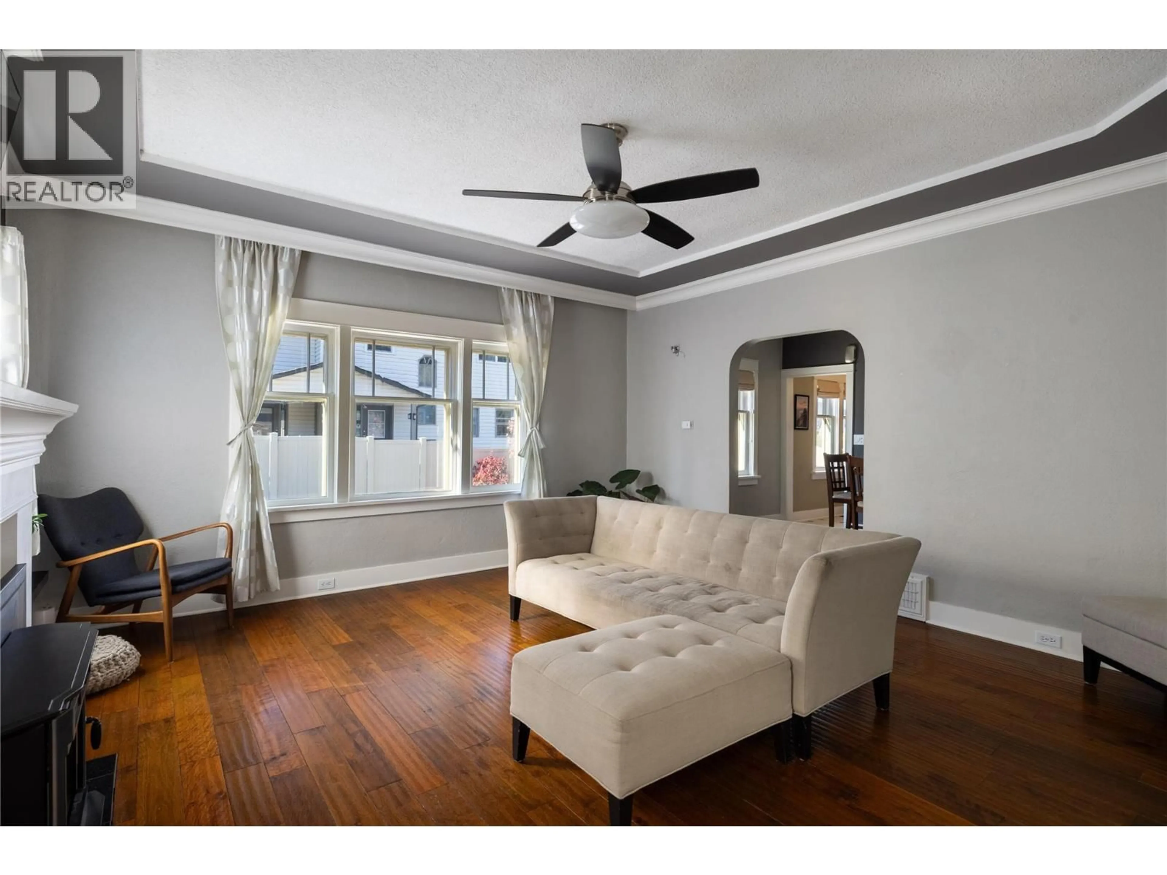 Living room with furniture, wood/laminate floor for 4004 PLEASANT VALLEY ROAD, Vernon British Columbia V1T4M2