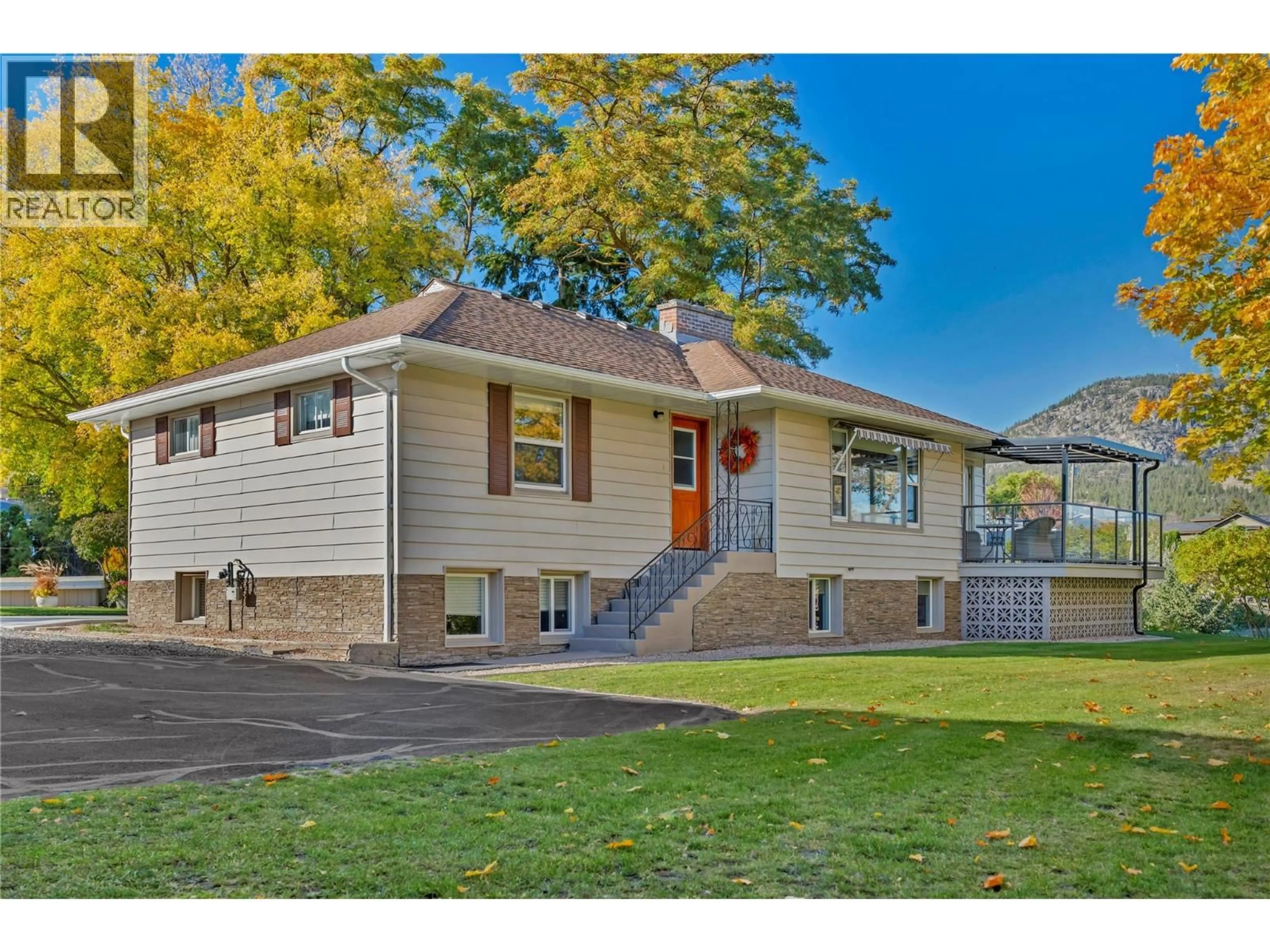 Home with vinyl exterior material, street for 1005 WEST BENCH DRIVE, Penticton British Columbia V2A8Y4