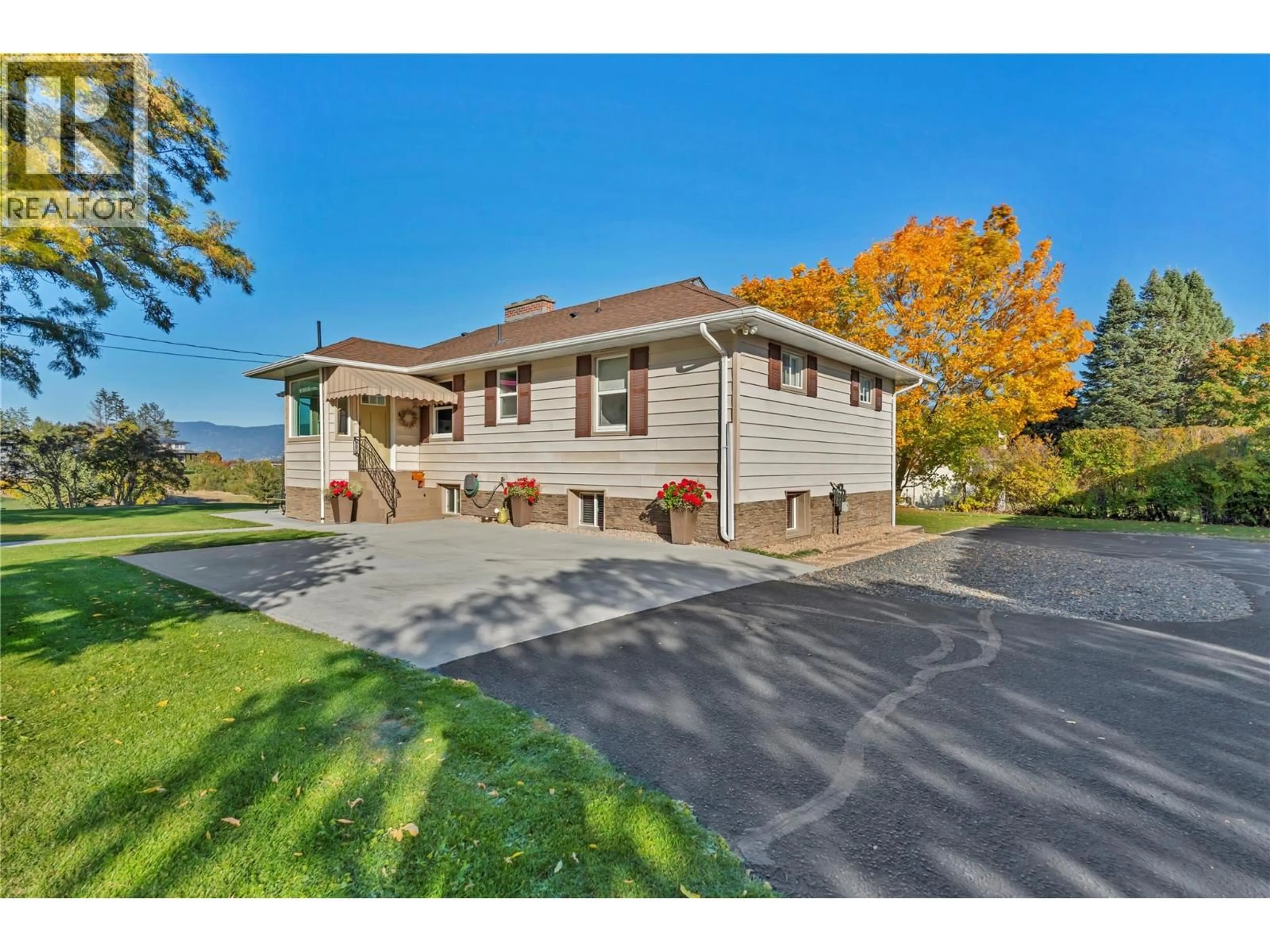 A pic from outside/outdoor area/front of a property/back of a property/a pic from drone, street for 1005 WEST BENCH DRIVE, Penticton British Columbia V2A8Y4