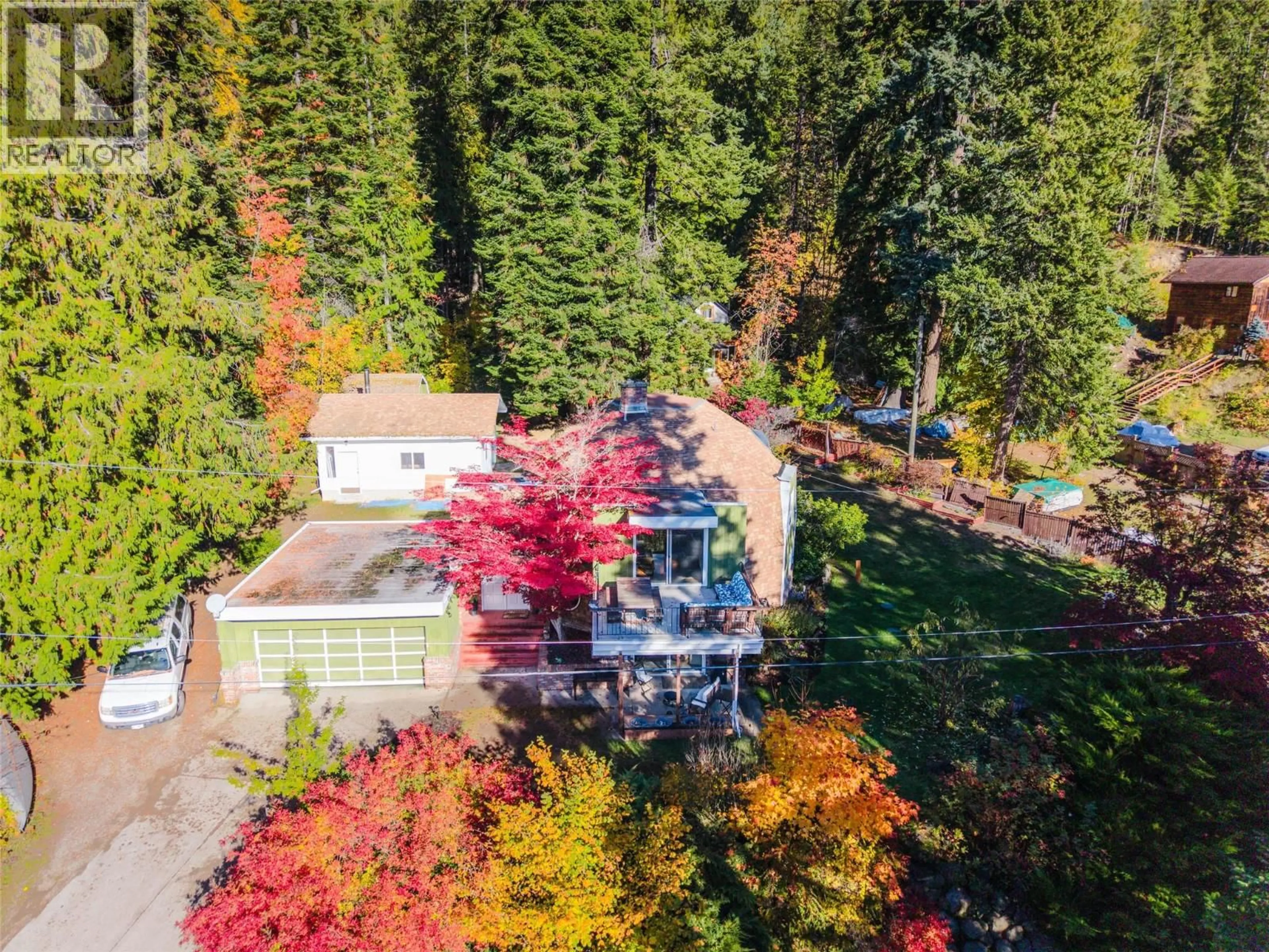 A pic from outside/outdoor area/front of a property/back of a property/a pic from drone, forest/trees view for 5657 LONGBEACH ROAD, Nelson British Columbia V1L6N9