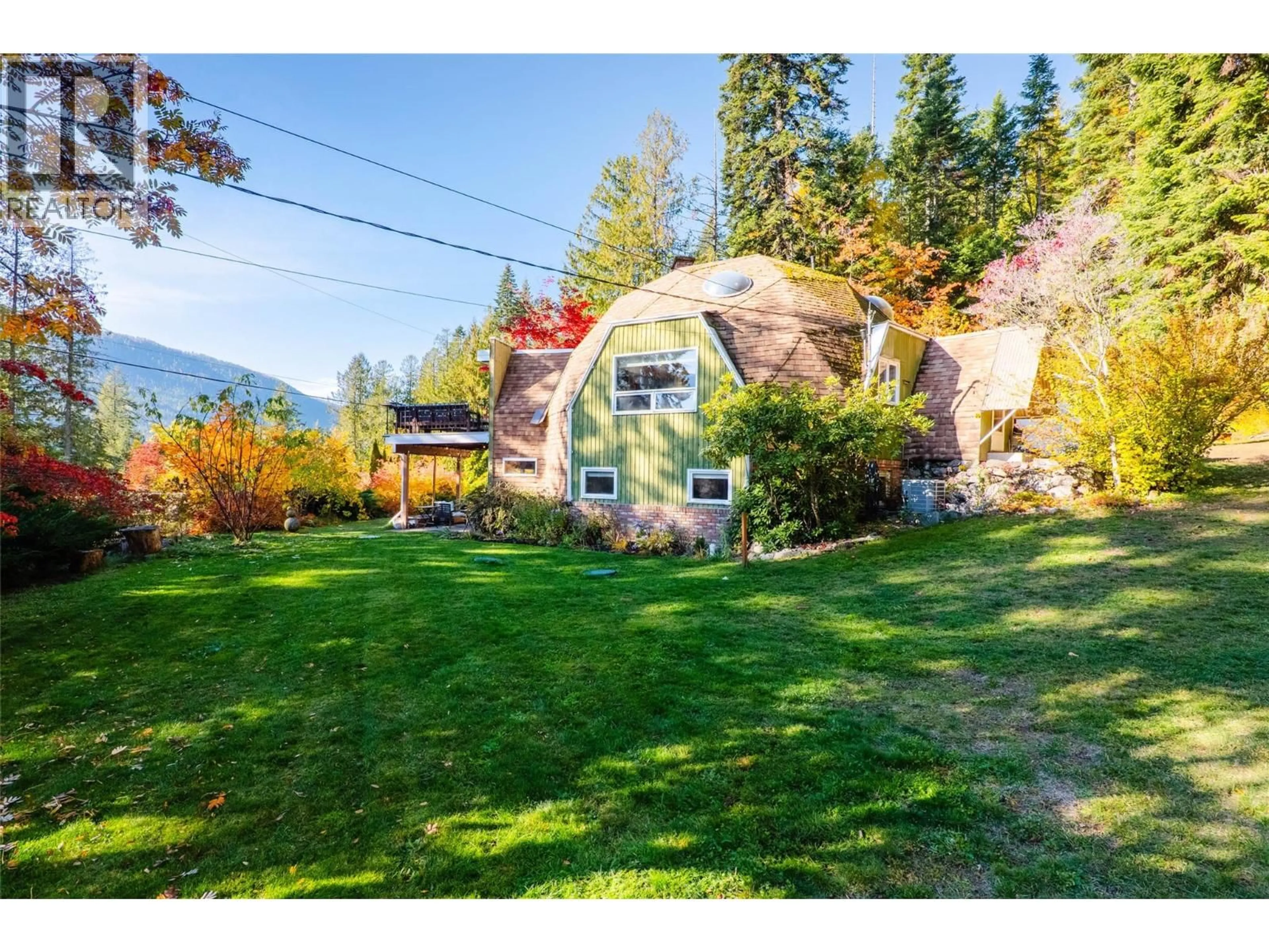 A pic from outside/outdoor area/front of a property/back of a property/a pic from drone, mountain view for 5657 LONGBEACH ROAD, Nelson British Columbia V1L6N9