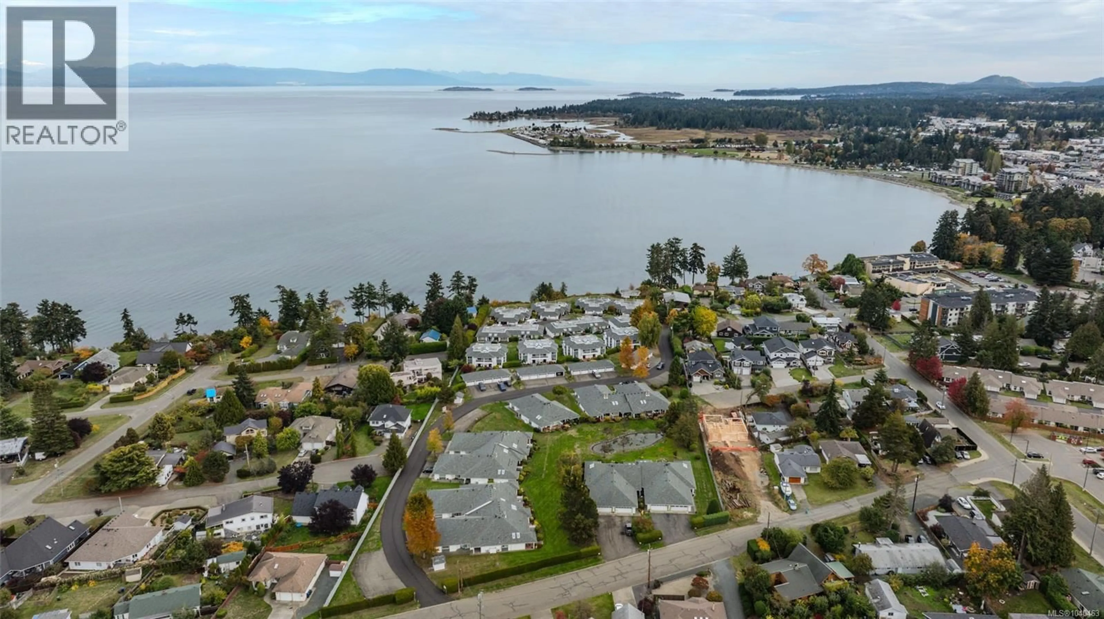A pic from outside/outdoor area/front of a property/back of a property/a pic from drone, water/lake/river/ocean view for 201 - 330 DOGWOOD STREET, Parksville British Columbia V9P1P7
