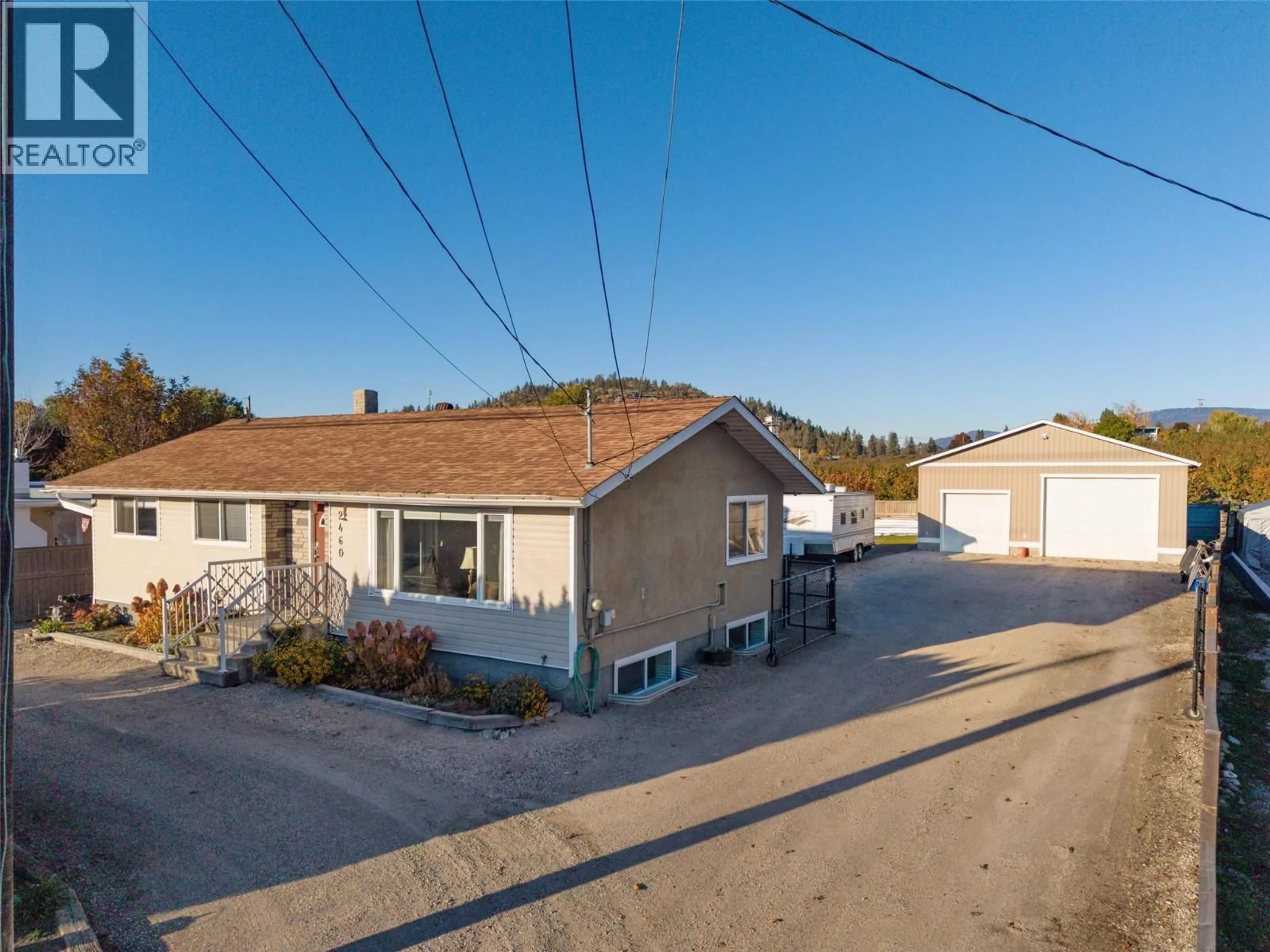 A pic from outside/outdoor area/front of a property/back of a property/a pic from drone, street for 2460 SEXSMITH ROAD, Kelowna British Columbia V1V2E9