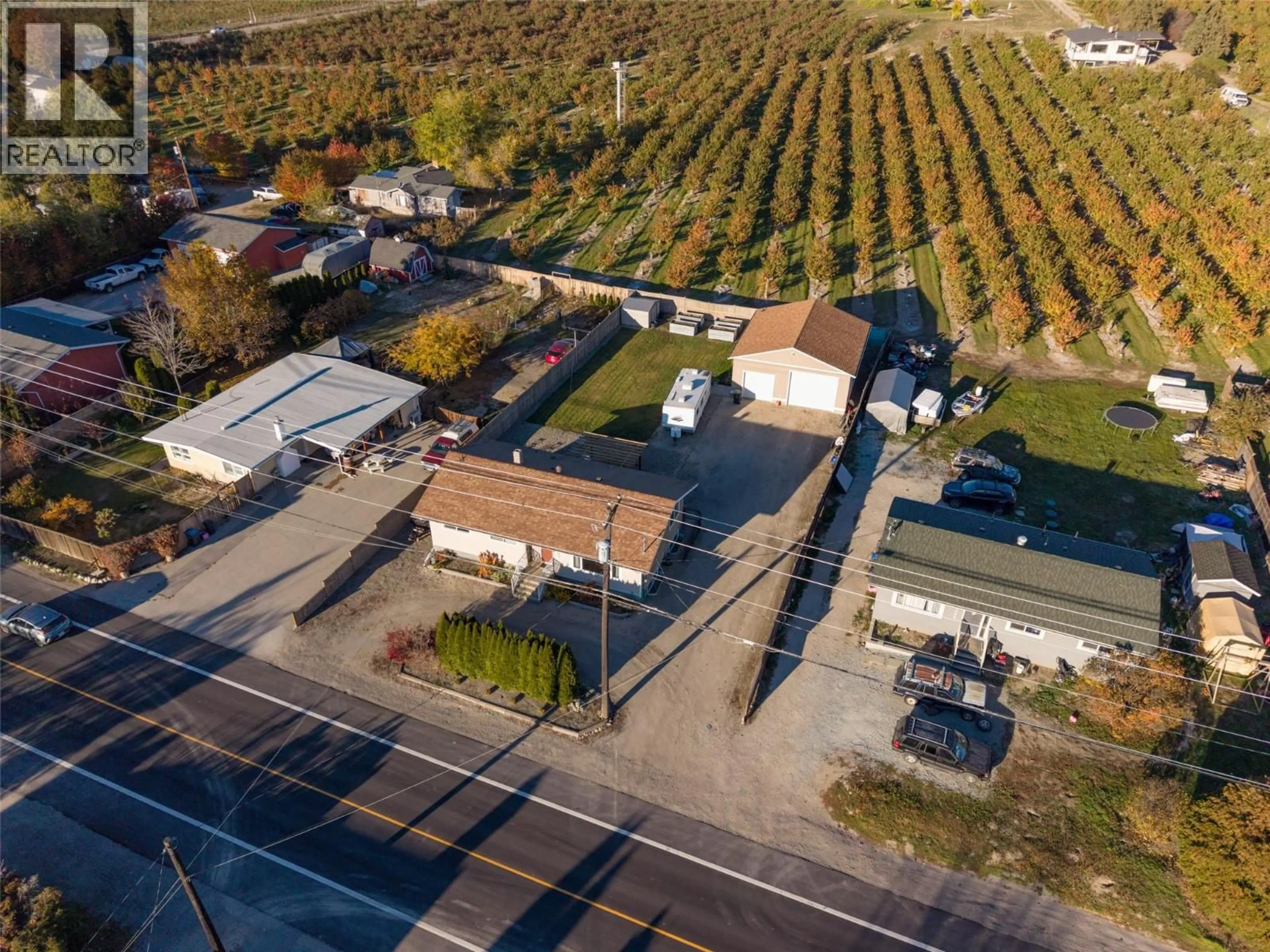 A pic from outside/outdoor area/front of a property/back of a property/a pic from drone, street for 2460 SEXSMITH ROAD, Kelowna British Columbia V1V2E9