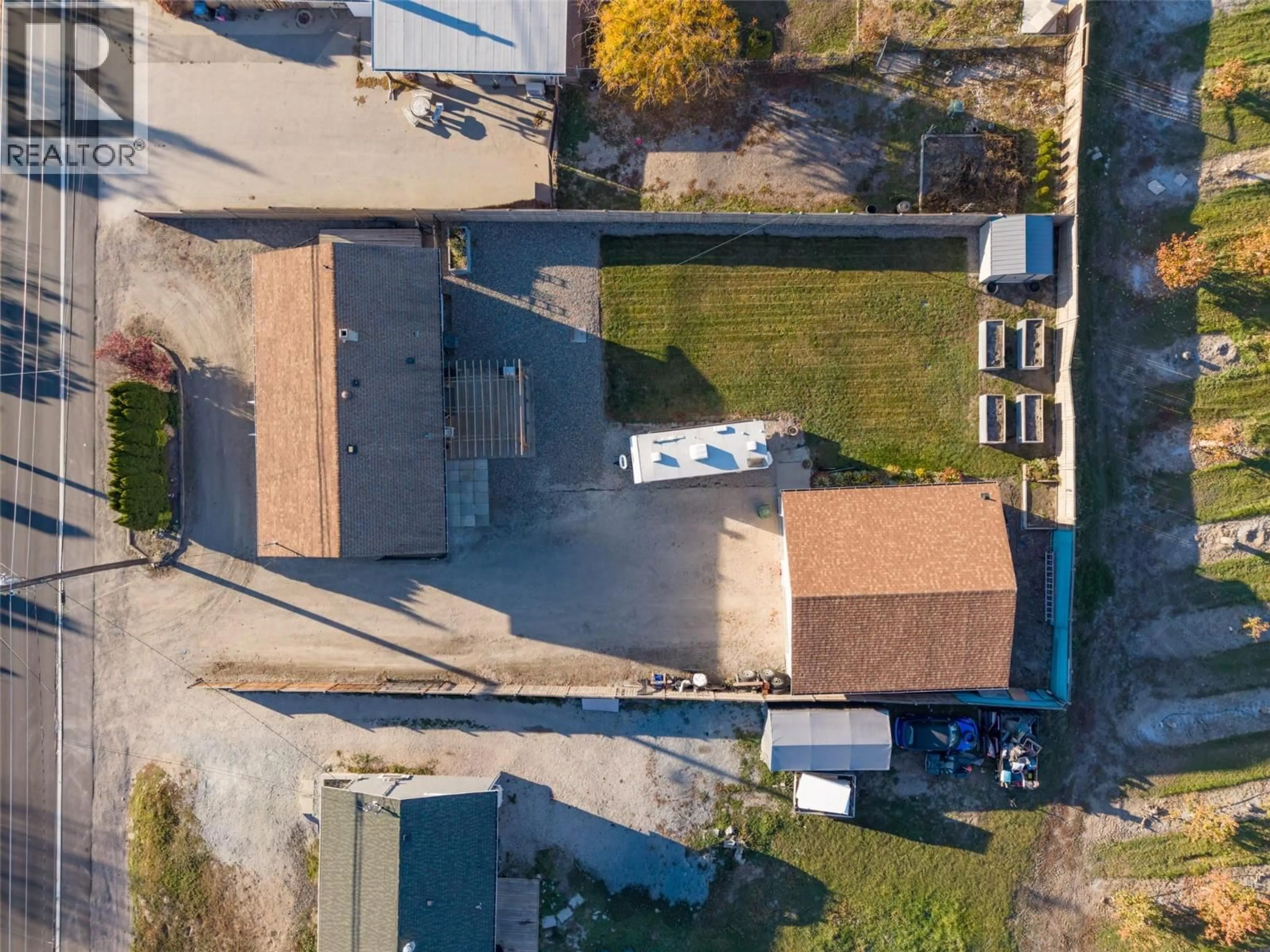 A pic from outside/outdoor area/front of a property/back of a property/a pic from drone, street for 2460 SEXSMITH ROAD, Kelowna British Columbia V1V2E9