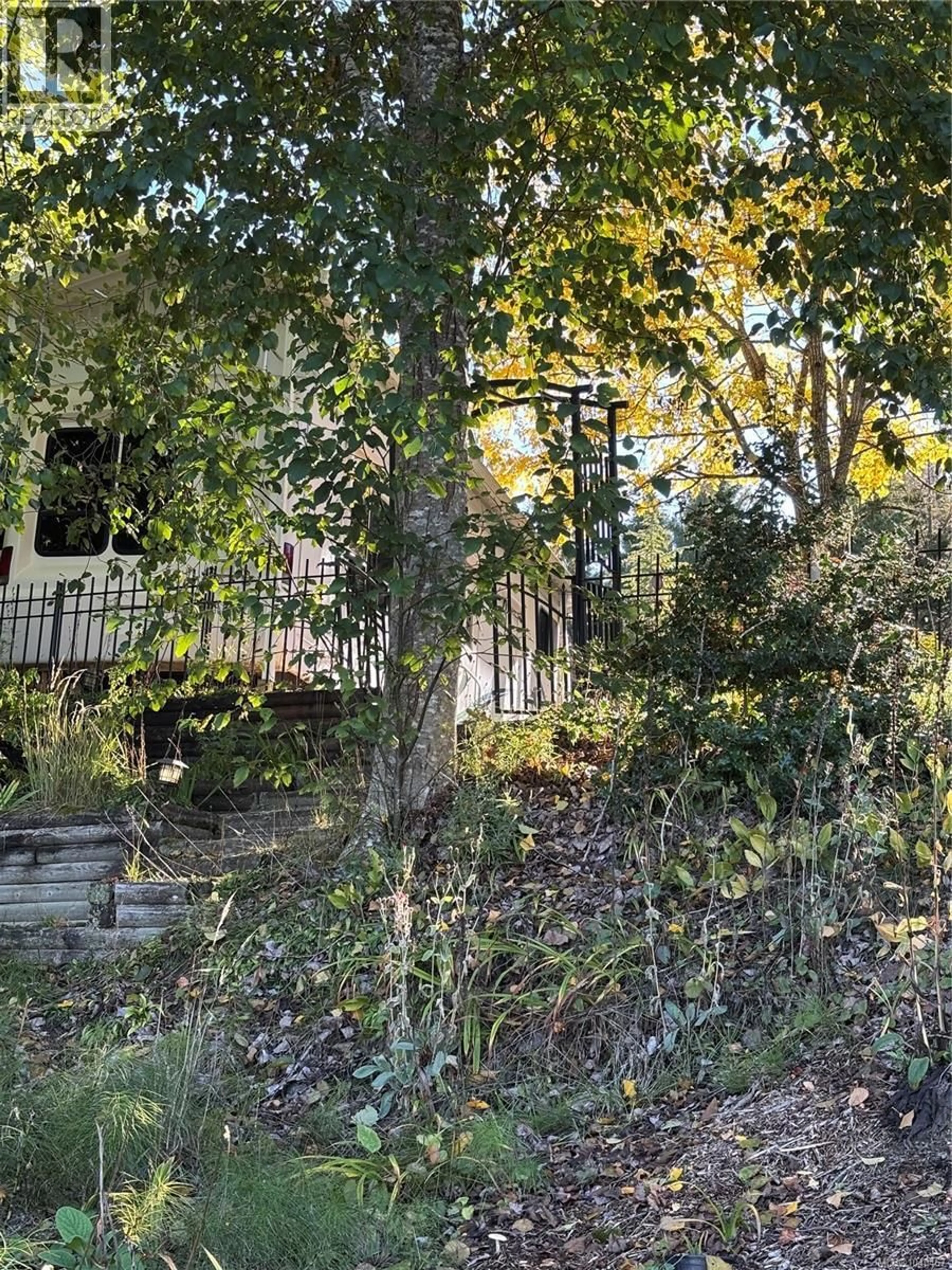A pic from outside/outdoor area/front of a property/back of a property/a pic from drone, forest/trees view for F15 - 2650 TURNBULL ROAD, Qualicum Beach British Columbia V9K2R2