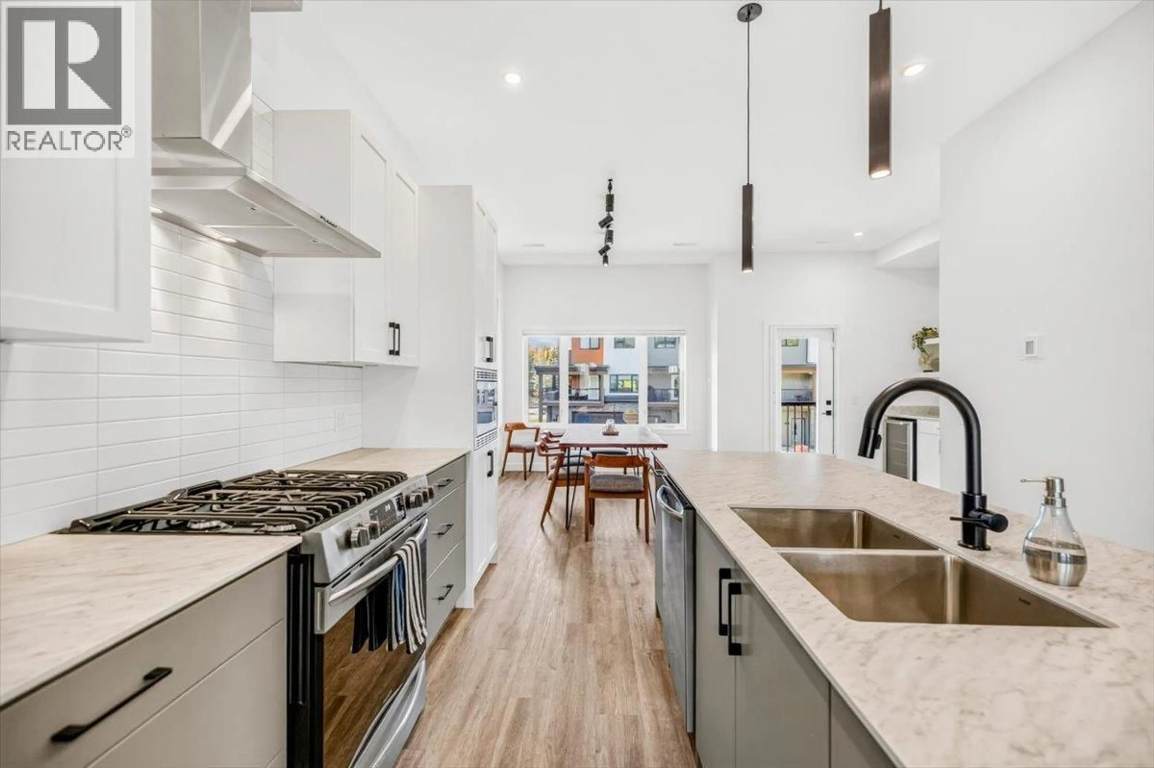 Open concept kitchen, ceramic/tile floor for 205 - 700 RIVERSIDE WAY, Fernie British Columbia V0B1M7